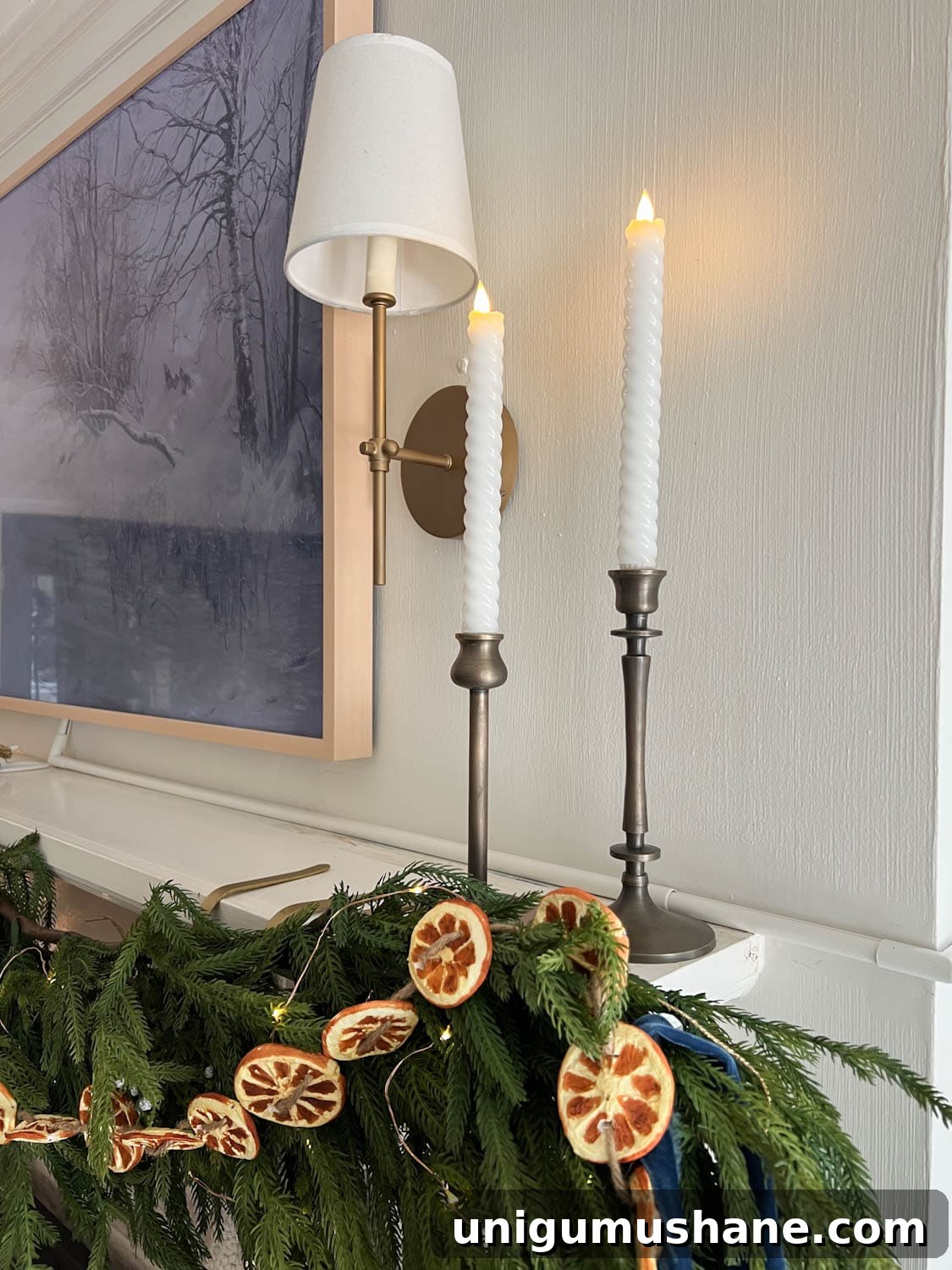Top Battery-Powered Christmas Lights to Buy on Amazon 9 wax battery operated candles on a Christmas mantel