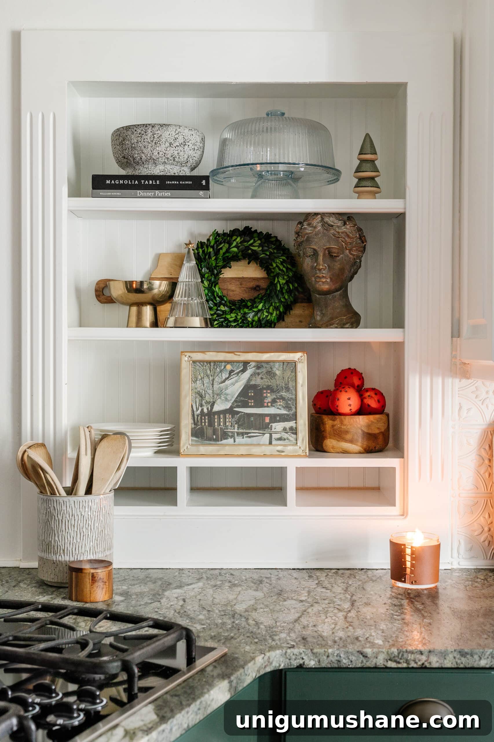 9 Quick Ways to Decorate Your Kitchen for Christmas 10 kitchen Christmas decor on shelves with mini wreath, winter art, and mini Christmas tree figurines