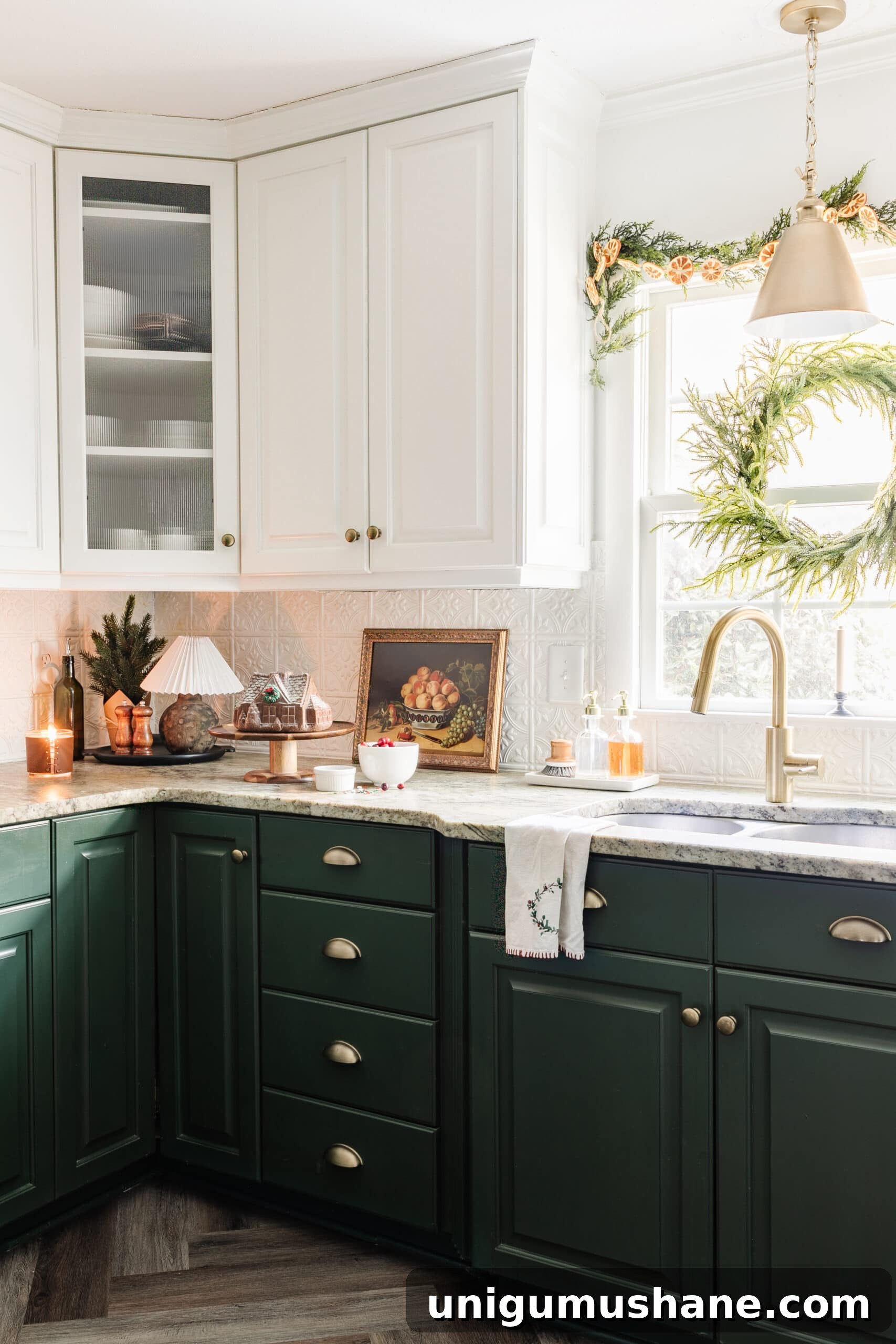 9 Quick Ways to Decorate Your Kitchen for Christmas 7 Christmas decor on a kitchen countertop and wreath and garland on window