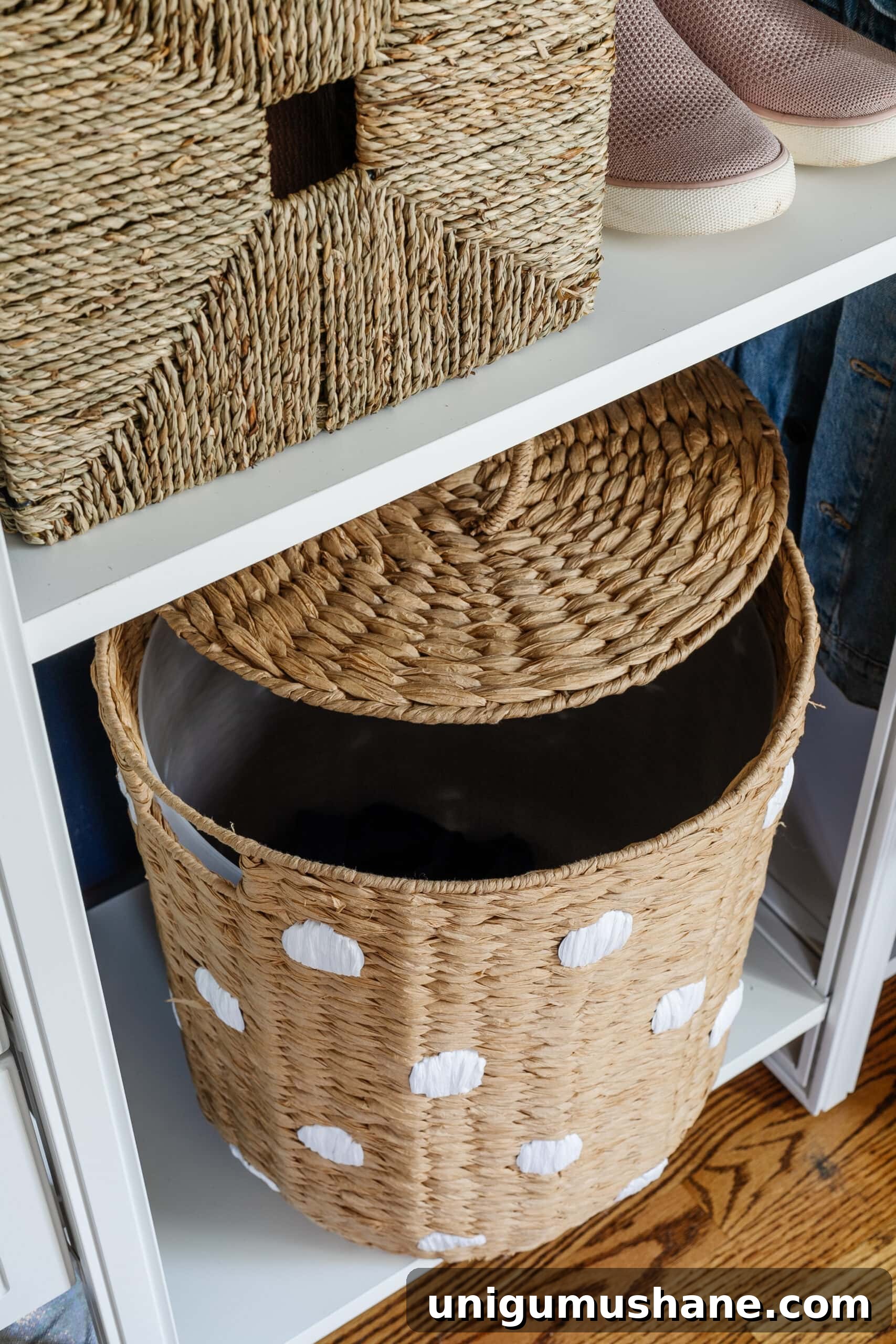 hamper stored on a shelf in a small closet