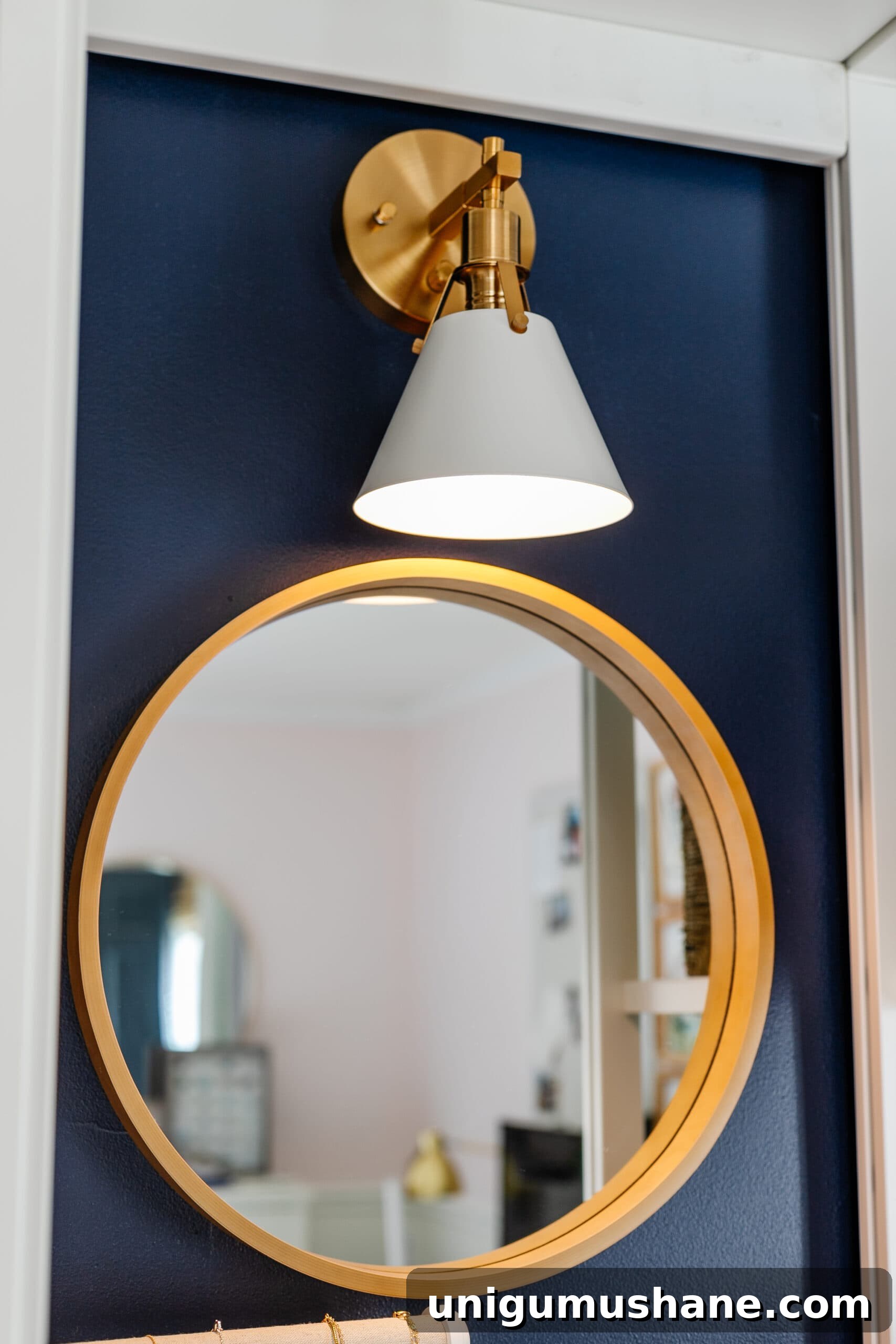 closet lighting using a sconce with battery puck light over a mirror