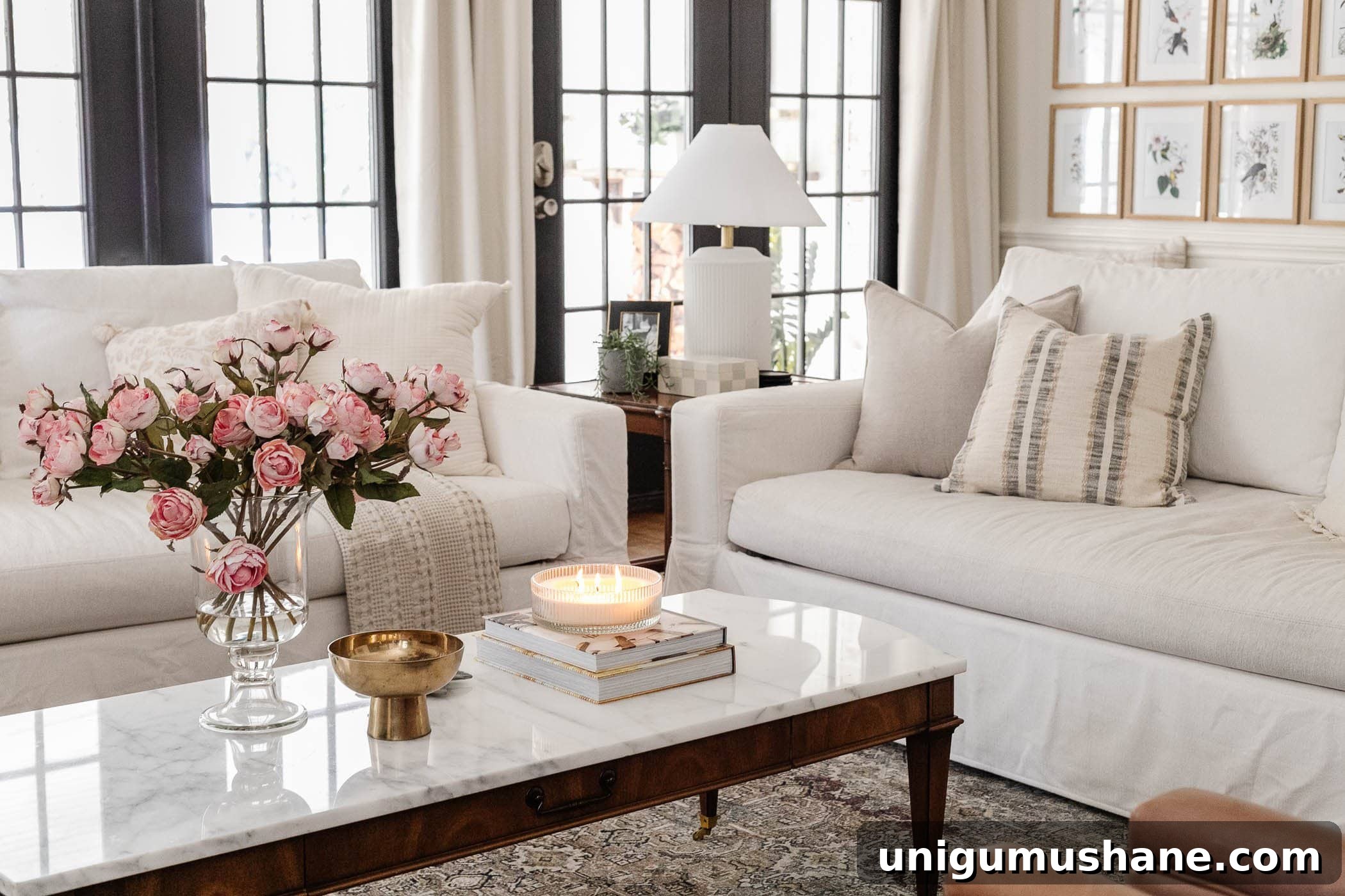 Parisian Chic Home Decor on a Budget 16 marble top coffee table in living room with couches and vase of pink roses