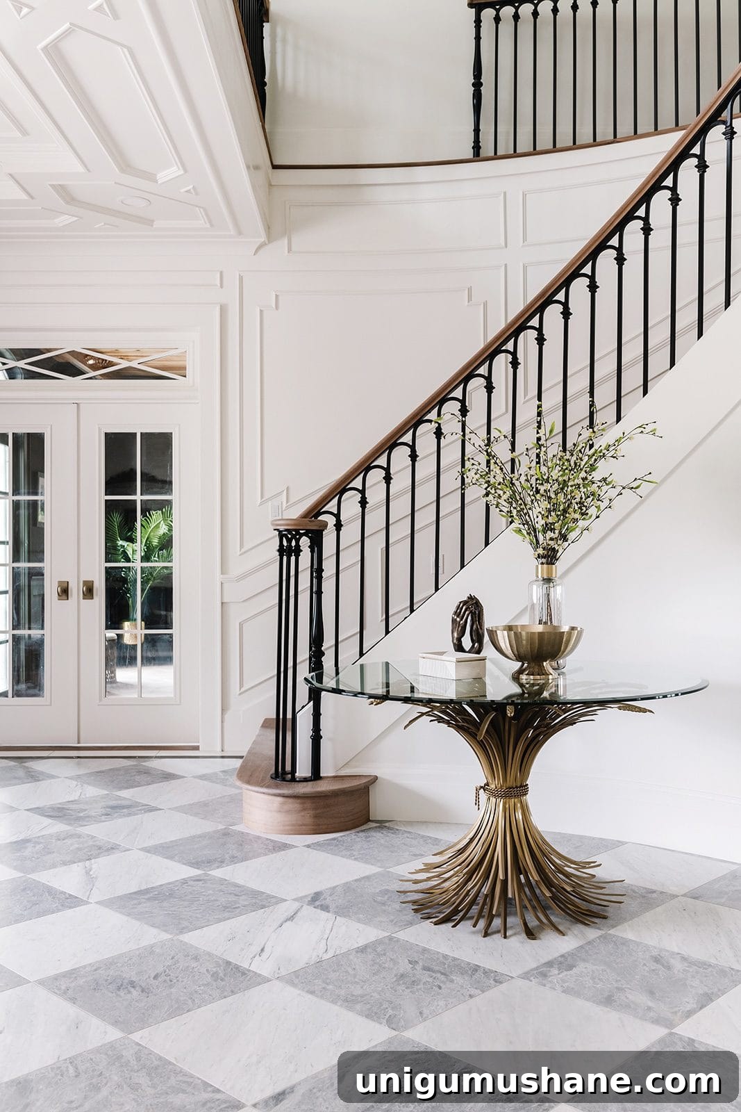 9 Black Stair Railing Ideas to Elevate Your Foyer 6 entryway staircase with wood handrail and black scalloped balusters