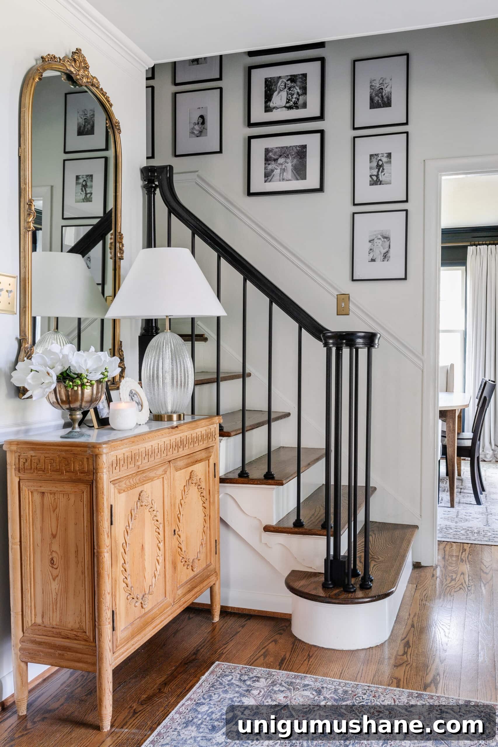 Replace Stair Spindles: DIY Staircase Makeover Guide 2 foyer with small staircase with black stair railing and family gallery wall