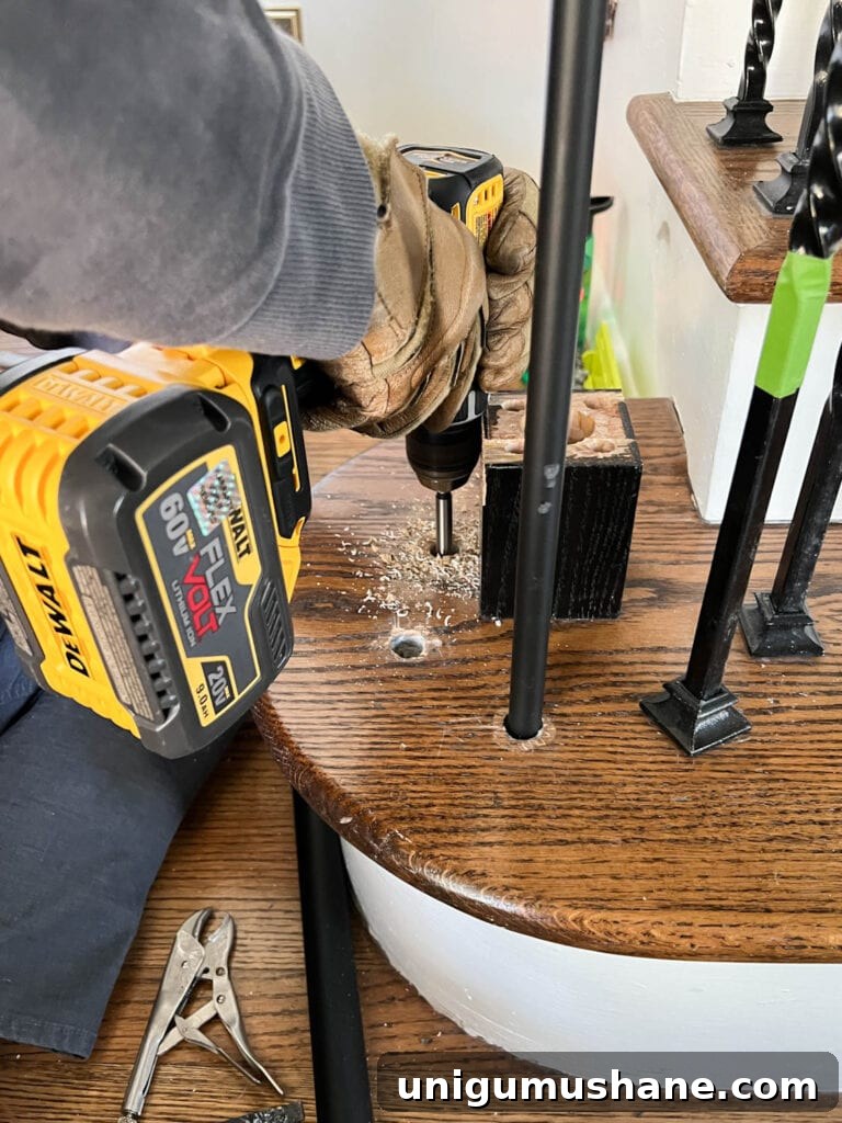 Replace Stair Spindles: DIY Staircase Makeover Guide 11 drilling new baluster holes on stair treads with a forstner bit