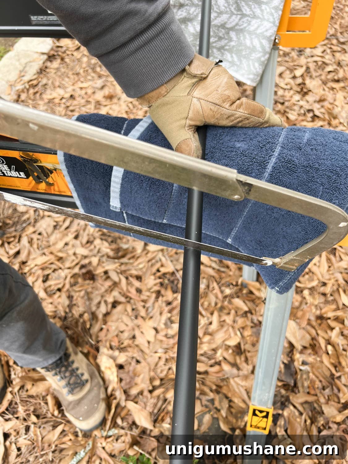 Replace Stair Spindles: DIY Staircase Makeover Guide 13 cutting new stair balusters with a hack saw