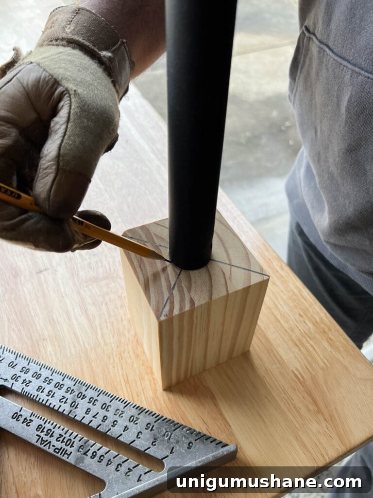 Replace Stair Spindles: DIY Staircase Makeover Guide 17 marking a new newel post mount from a wood block