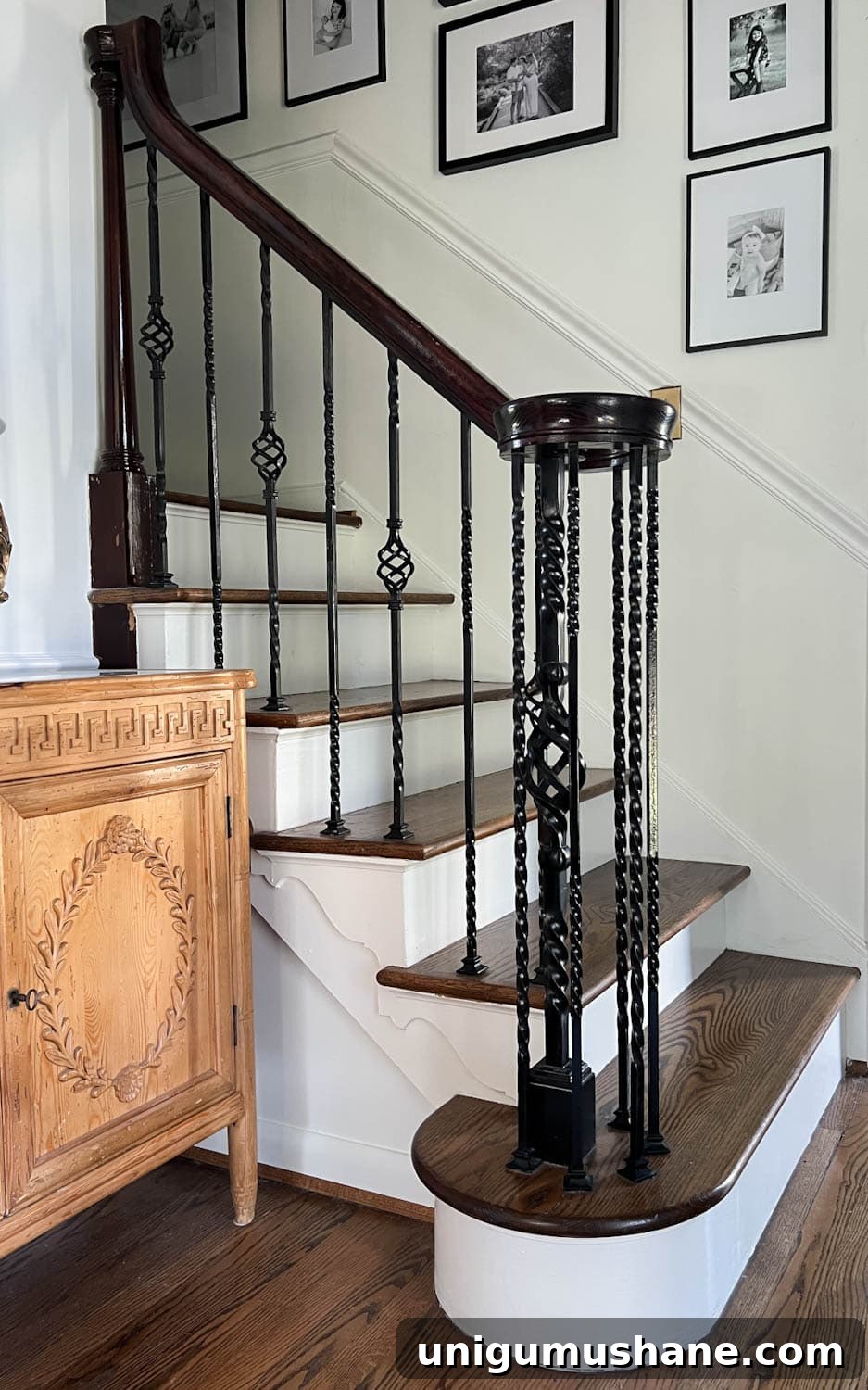 Replace Stair Spindles: DIY Staircase Makeover Guide 3 twisted iron balusters on a railing before makeover