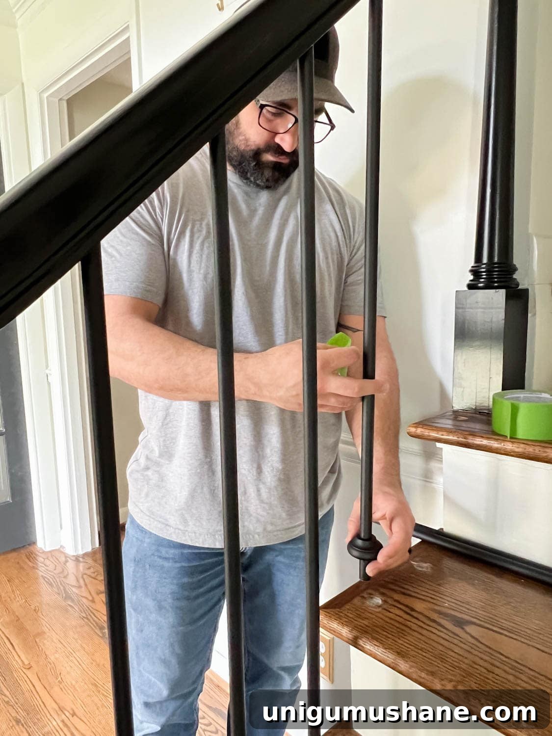 Replace Stair Spindles: DIY Staircase Makeover Guide 20 adding shoes to iron stair balusters