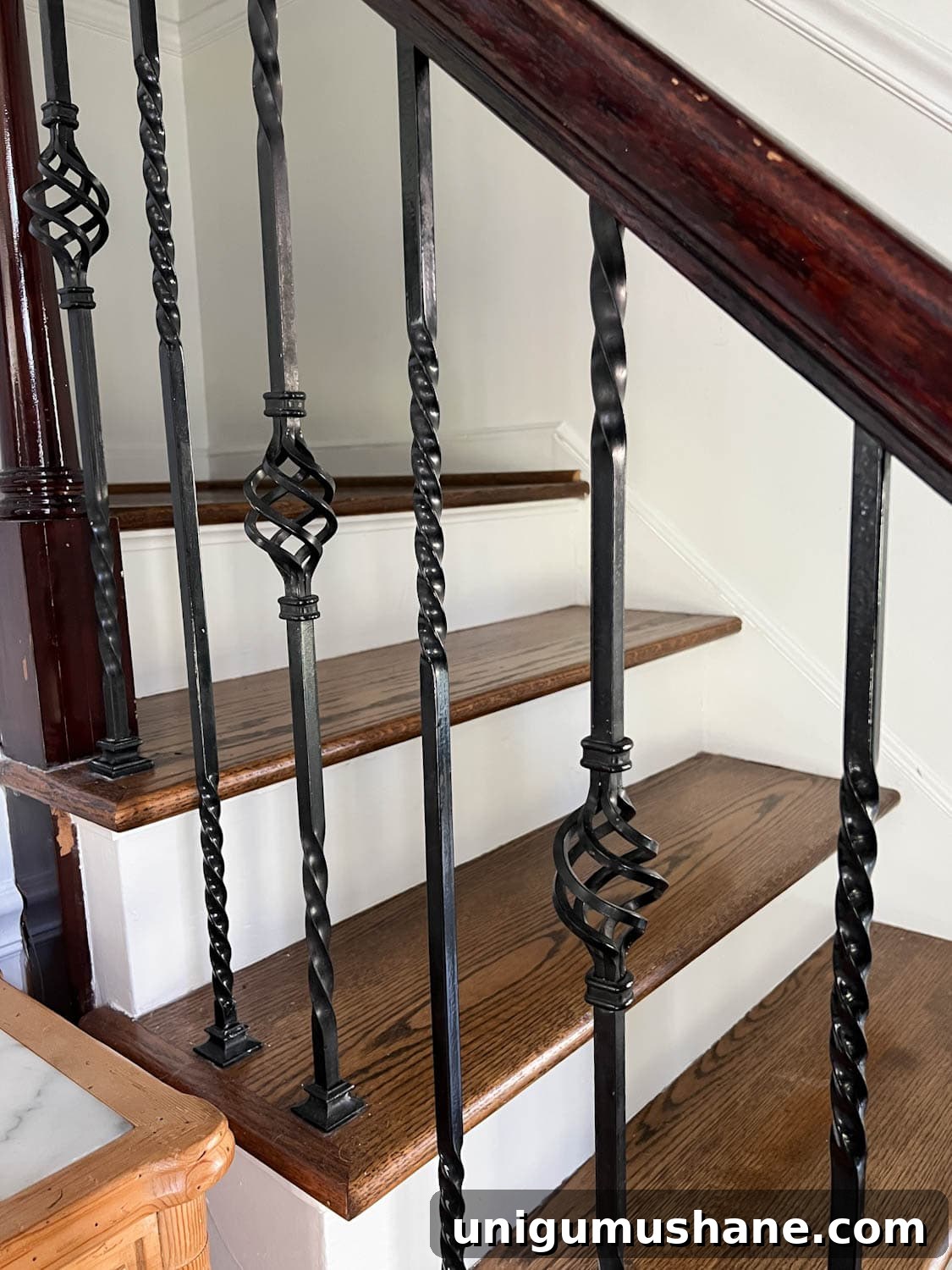 Replace Stair Spindles: DIY Staircase Makeover Guide 6 twisted wrought iron stair balusters