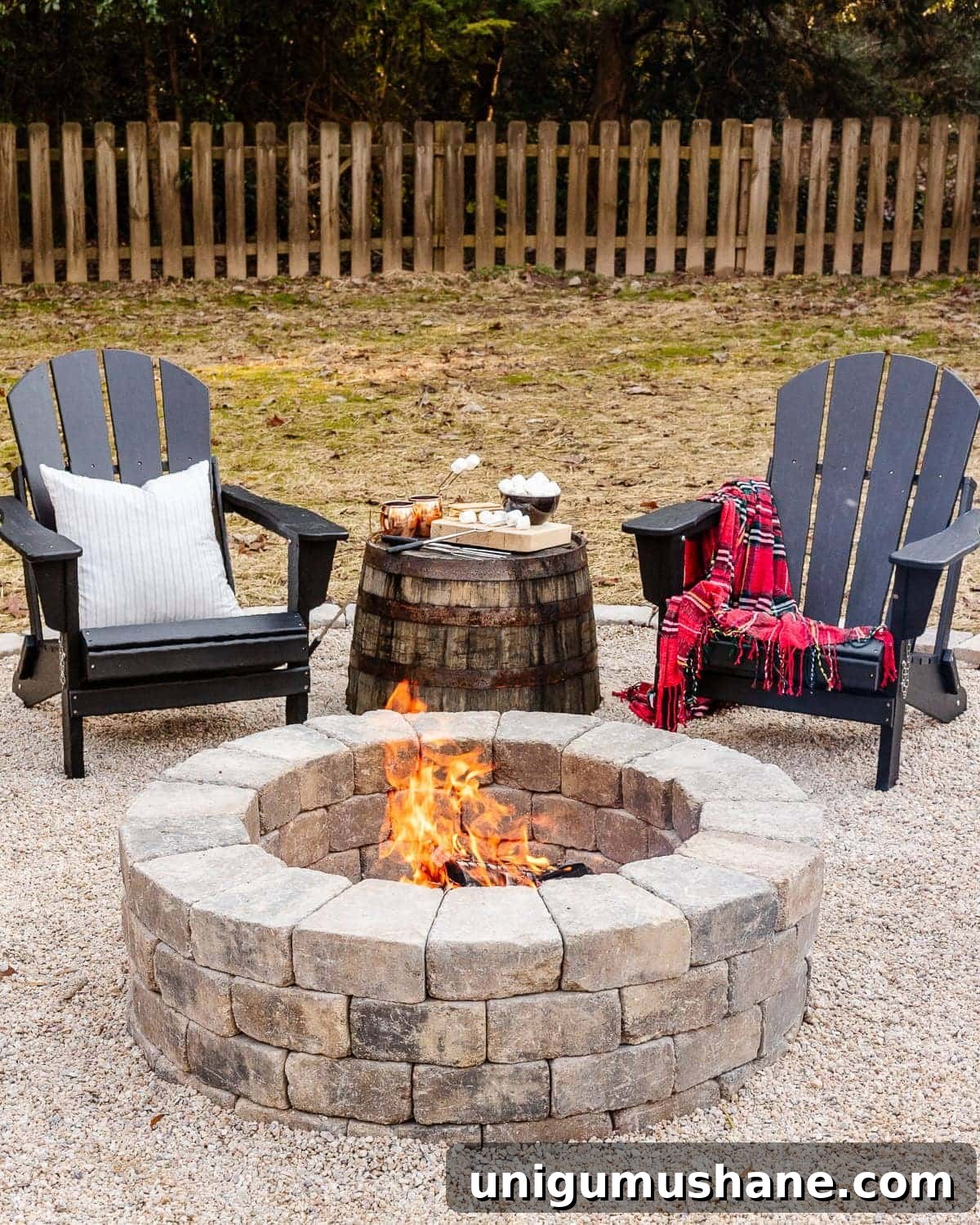 41 Budget-Friendly Backyard Projects for Outdoor Living 14 diy stone fire pit in a backyard with adirondack chairs