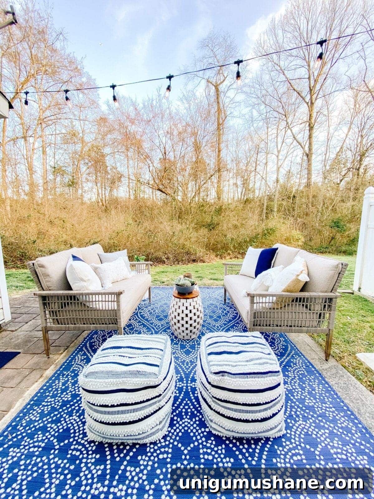 41 Budget-Friendly Backyard Projects for Outdoor Living 25 outdoor rug and patio sofas on patio with string lights