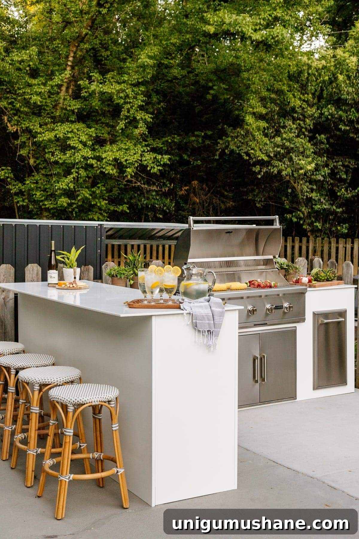 41 Budget-Friendly Backyard Projects for Outdoor Living 27 white modular outdoor kitchen with french bistro stools