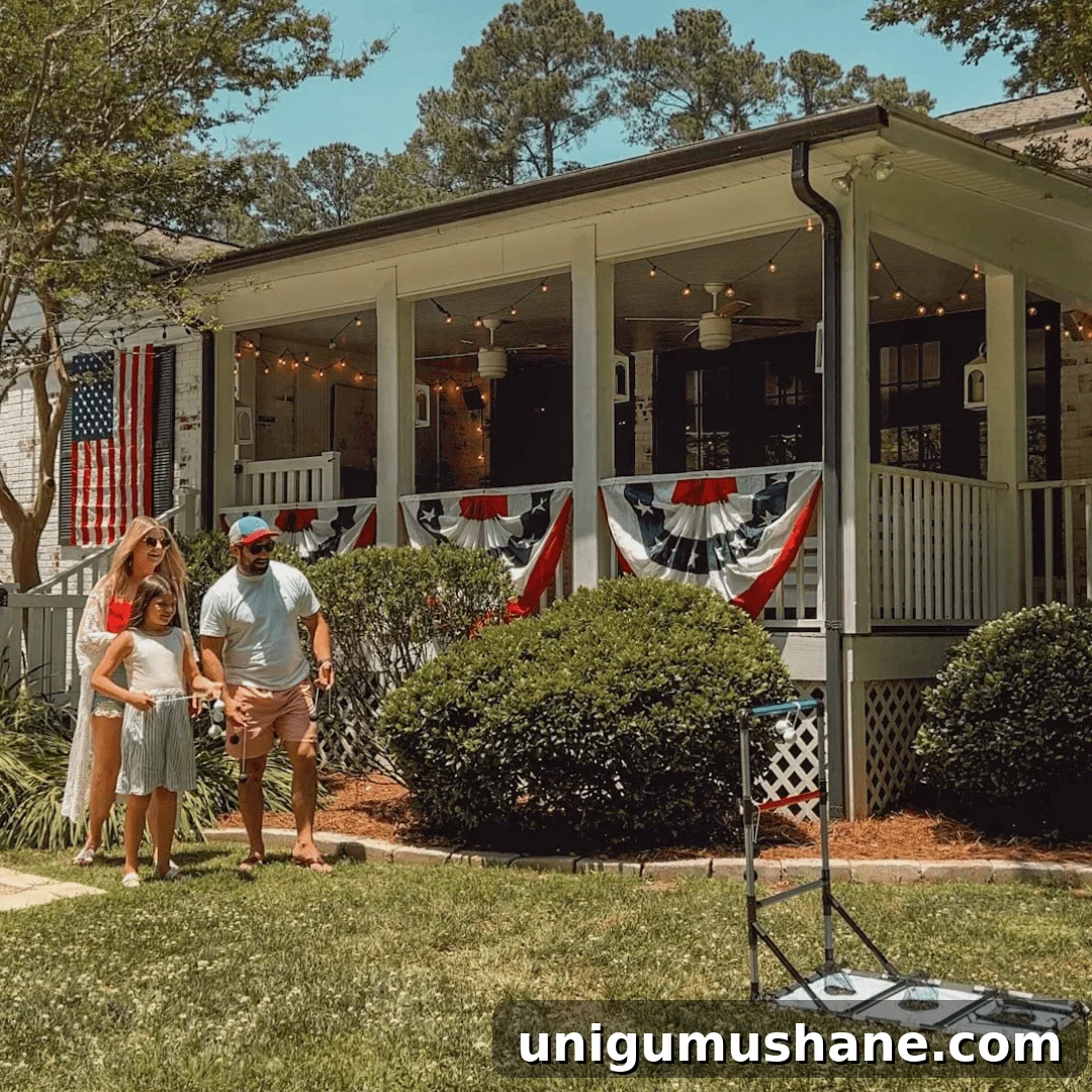 41 Budget-Friendly Backyard Projects for Outdoor Living 31 family playing lawn games in the backyard with July 4th decor