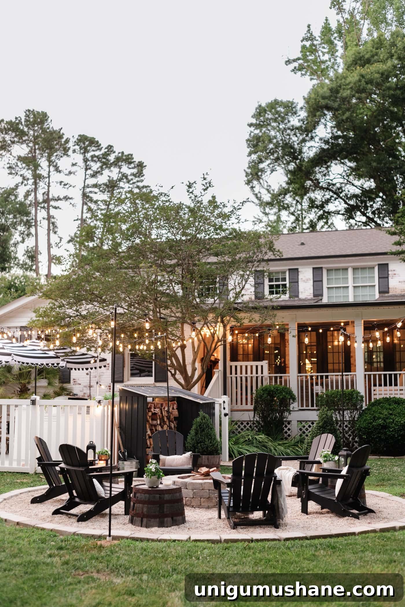 41 Budget-Friendly Backyard Projects for Outdoor Living 49 string lights around a fire pit in a backyard