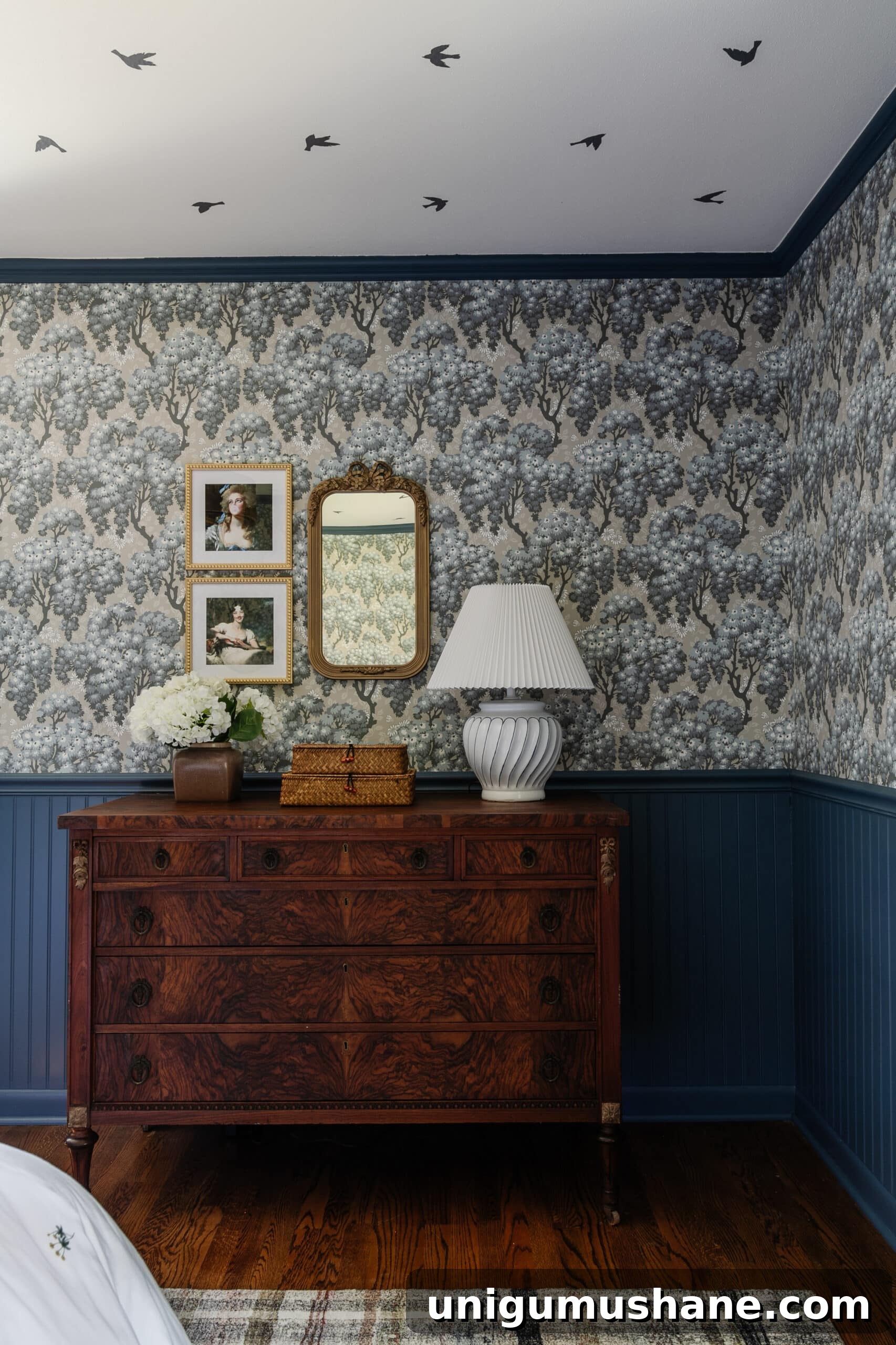 Blue Teen Bedroom Ideas and Girl's Room Tour 17 burl wood dresser with swedish cottage style wallpaper and gallery wall with mirror and altered portraits