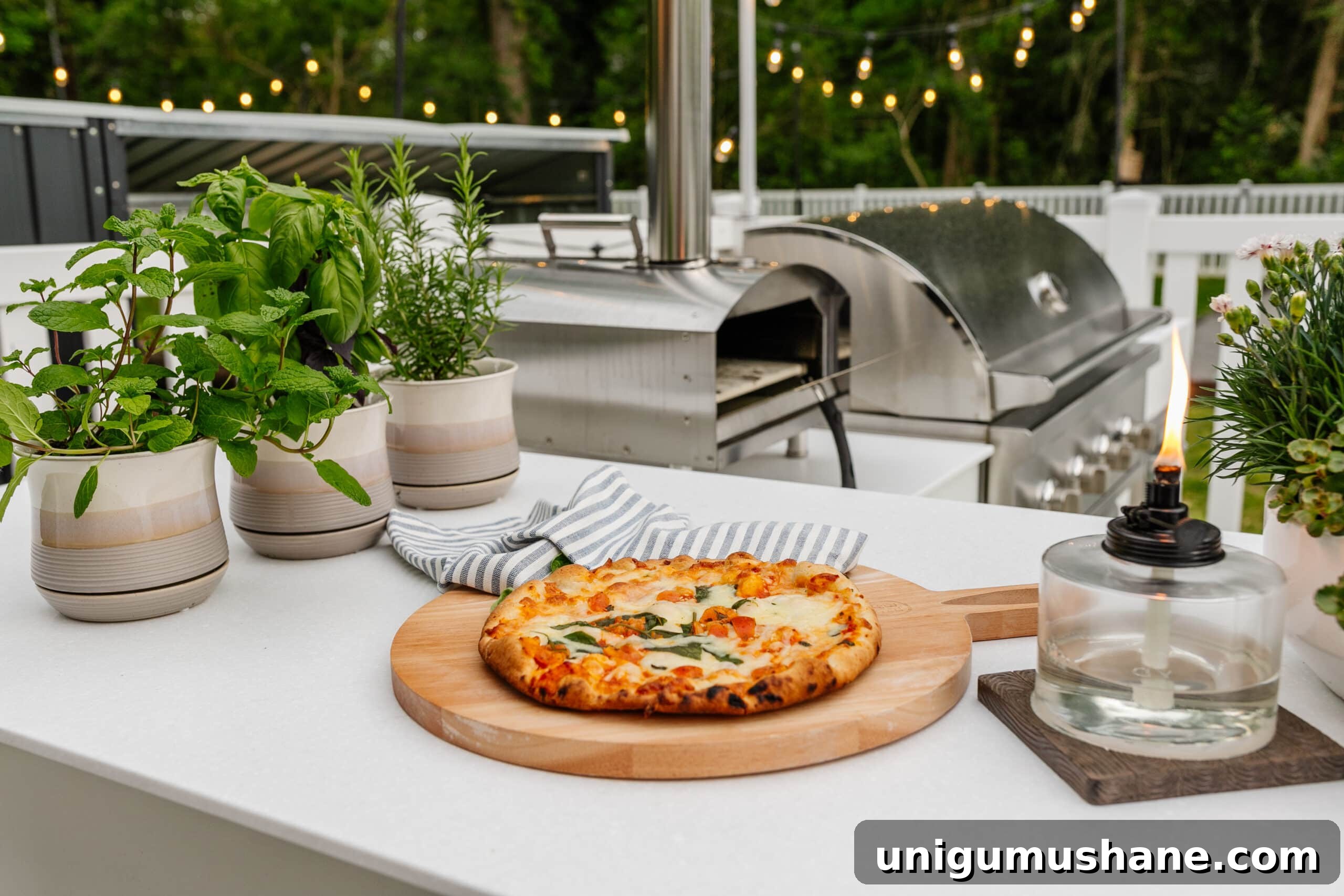 Spring Cleaning Checklist for Your Backyard Patio 12 backyard grill with outdoor pizza oven, tabletop tiki torch, and potted herbs