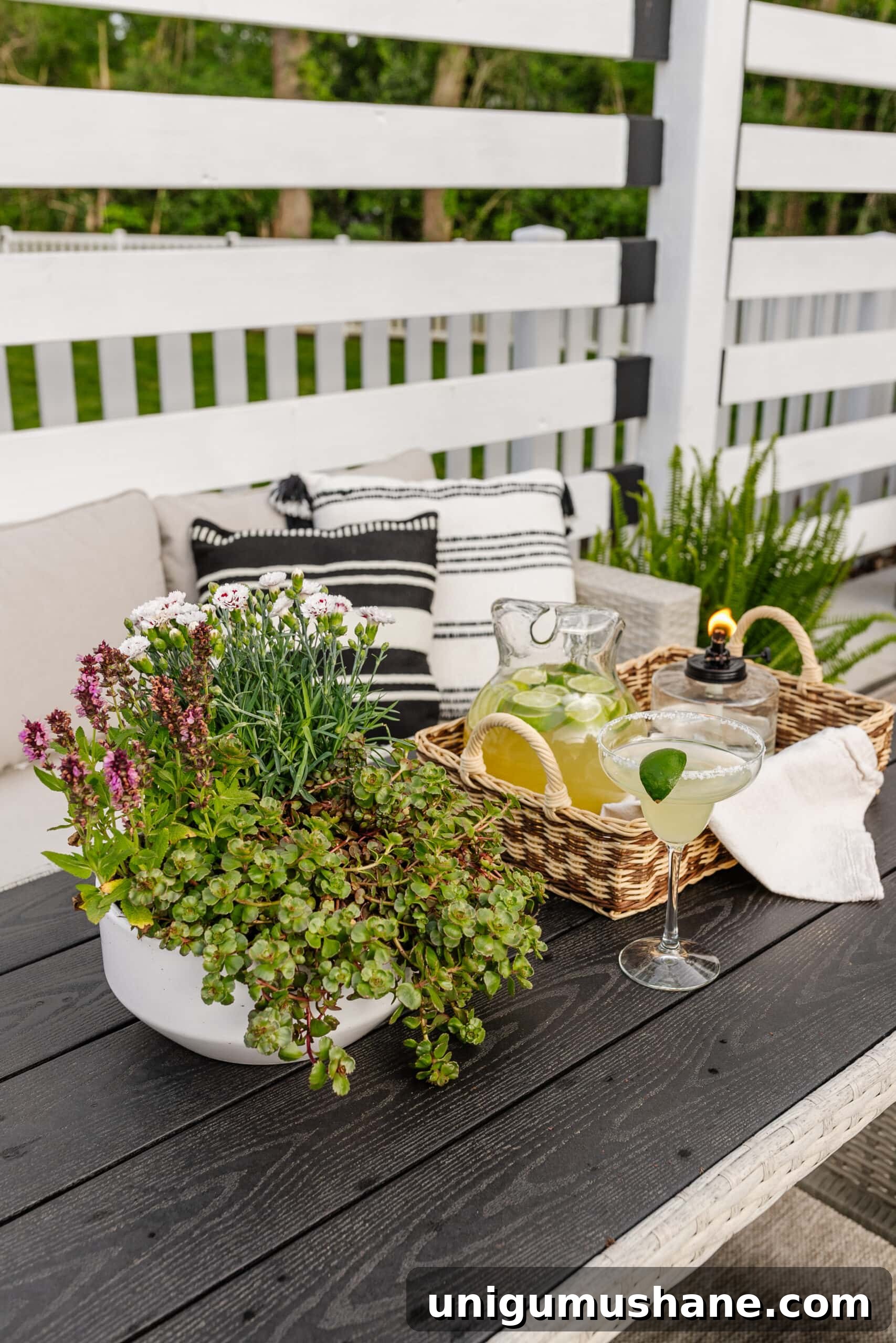Spring Cleaning Checklist for Your Backyard Patio 16 patio dining table with tray, tabletop tiki torch, margarita pitcher, and potted plant