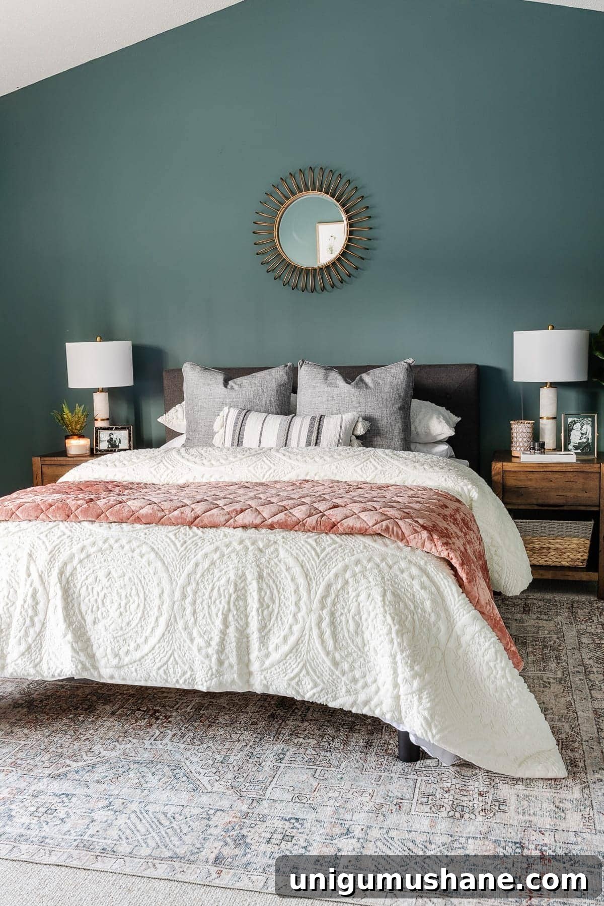 bedroom decorated with teal walls and loloi rug from Chris Loves Julia