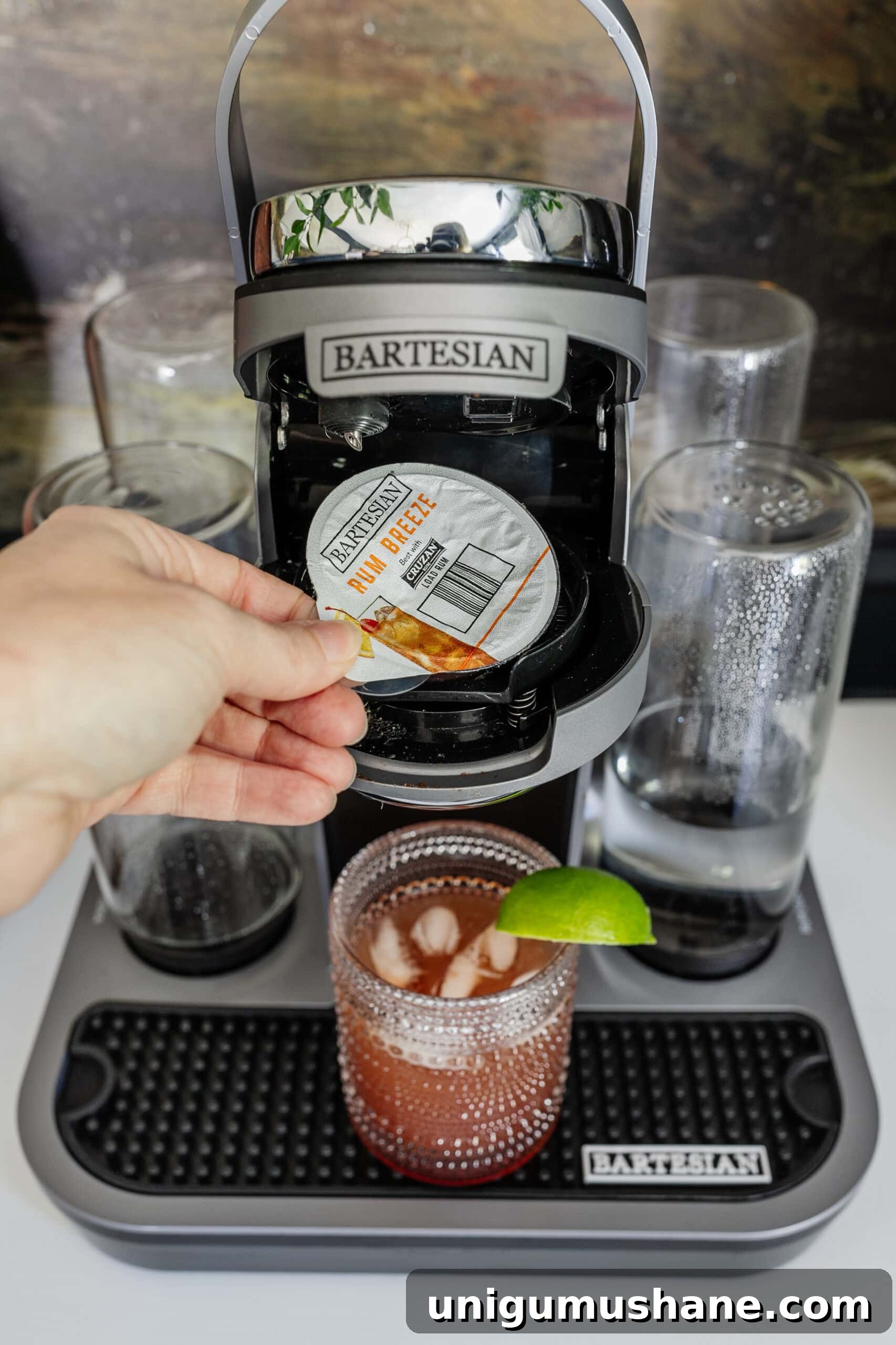 Bartesian Cocktail Maker Review: Unbiased Hands-On Verdict 5 adding a cocktail capsule to a bartesian machine