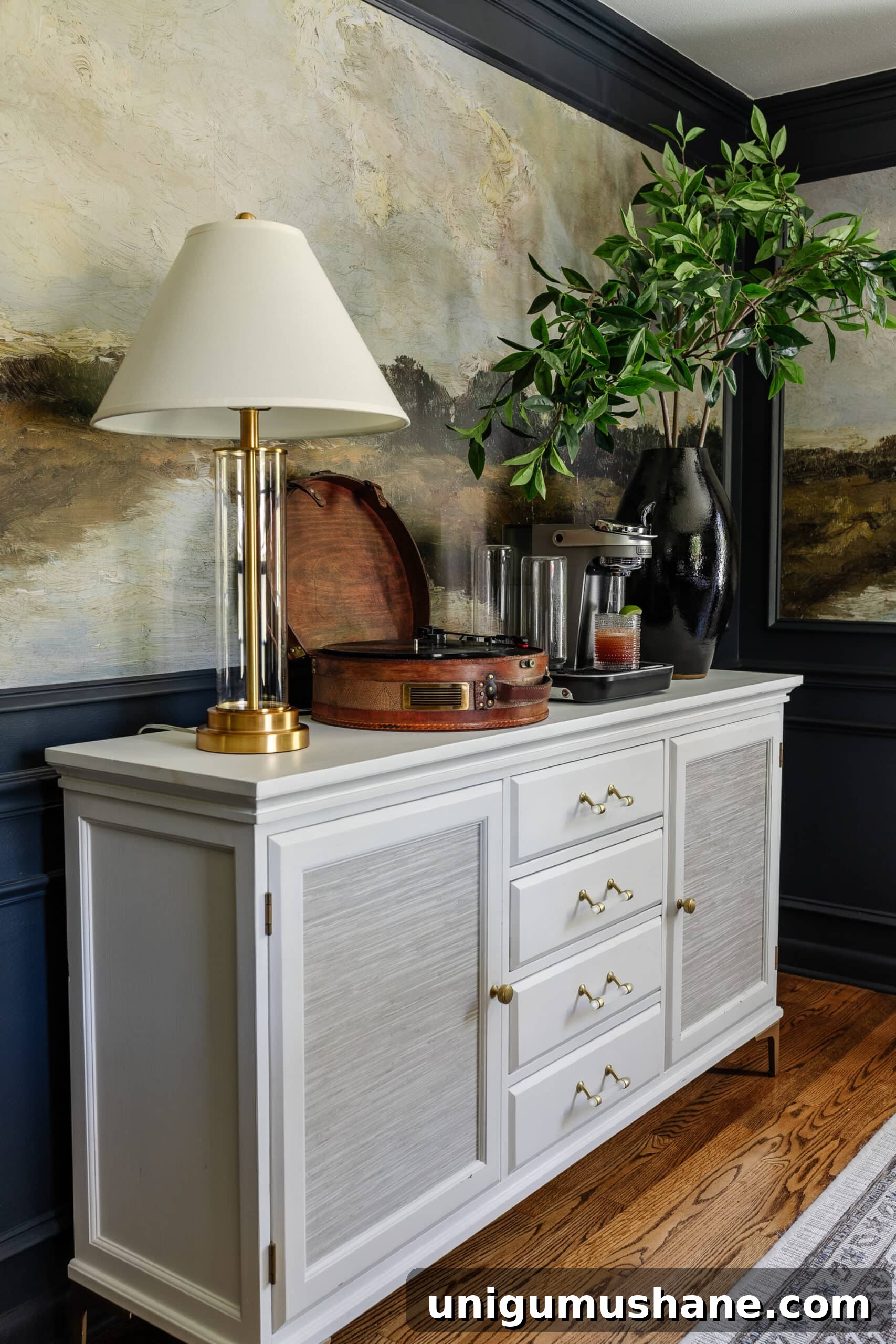 Bartesian Cocktail Maker Review: Unbiased Hands-On Verdict 10 dining room buffet with Bartesian cocktail machine, record player, vase of branches, and lamp
