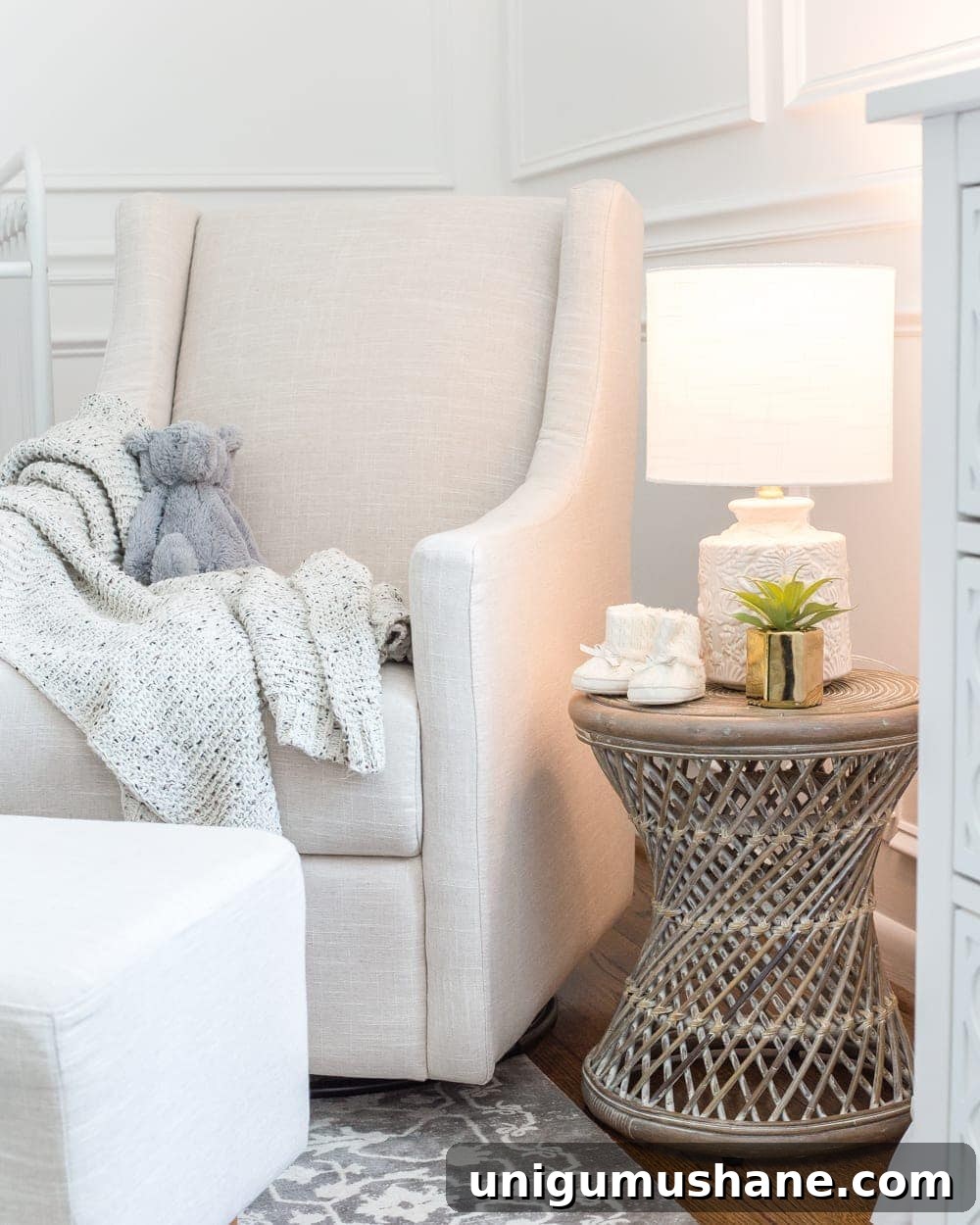 nursery glider rocking chair with rattan side table and lamp with a sleep light bulb