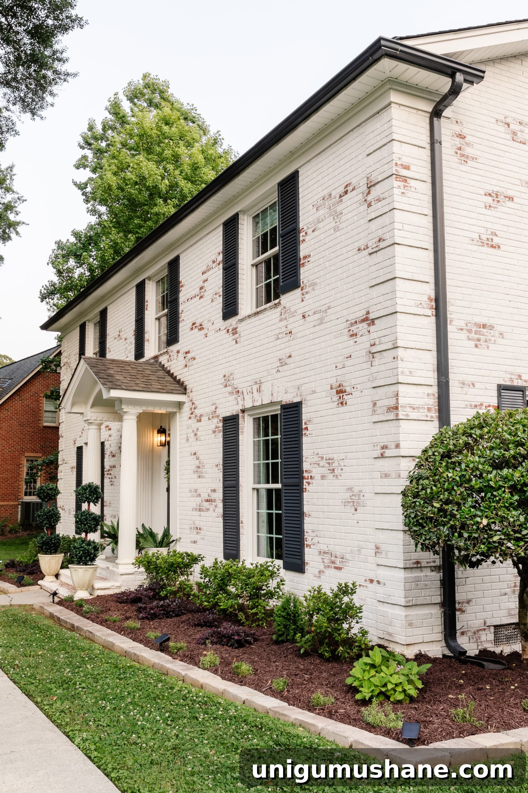 Limewashed Brick Cleaning and Maintenance Guide 15 limewashed brick colonial house and flower beds