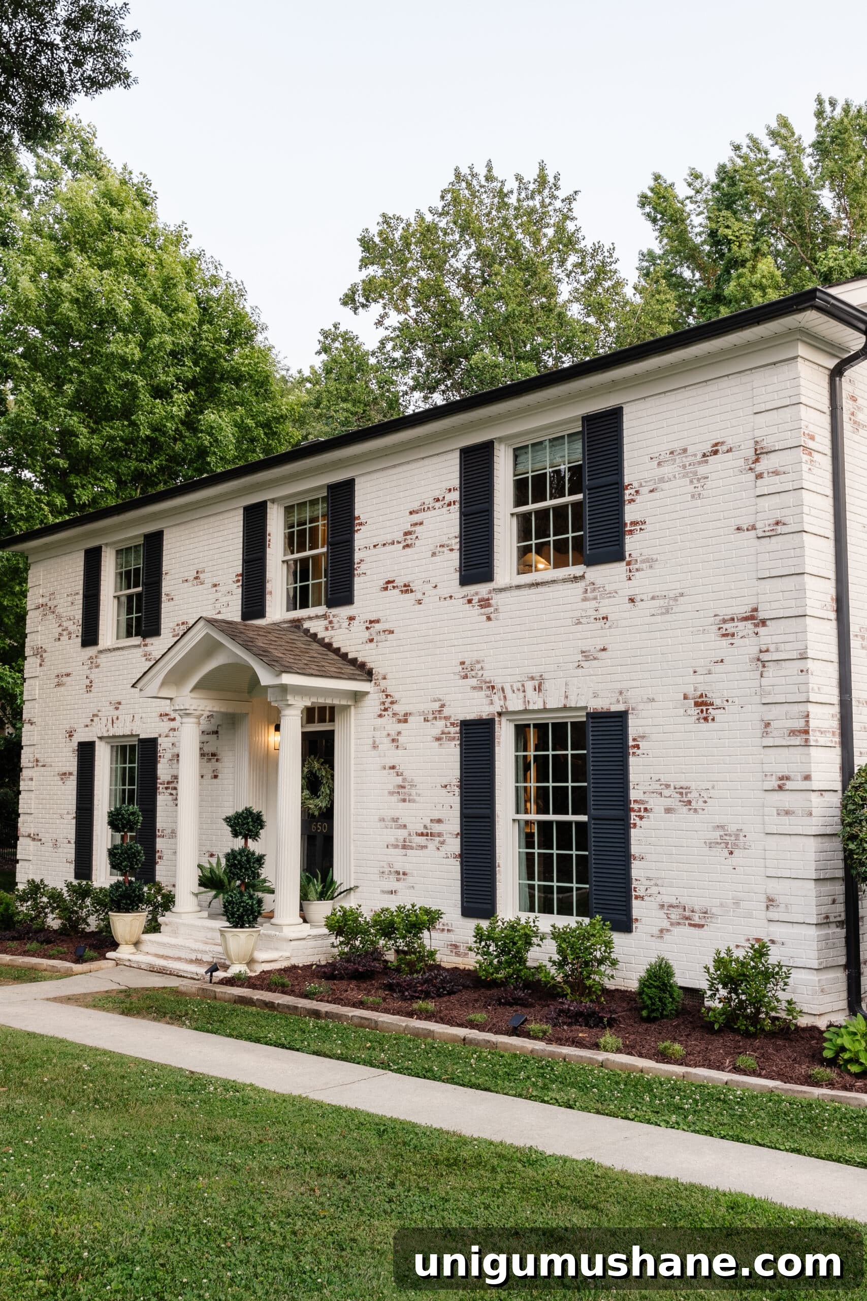 Limewashed Brick Cleaning and Maintenance Guide 16 limewashed brick colonial house and flower beds