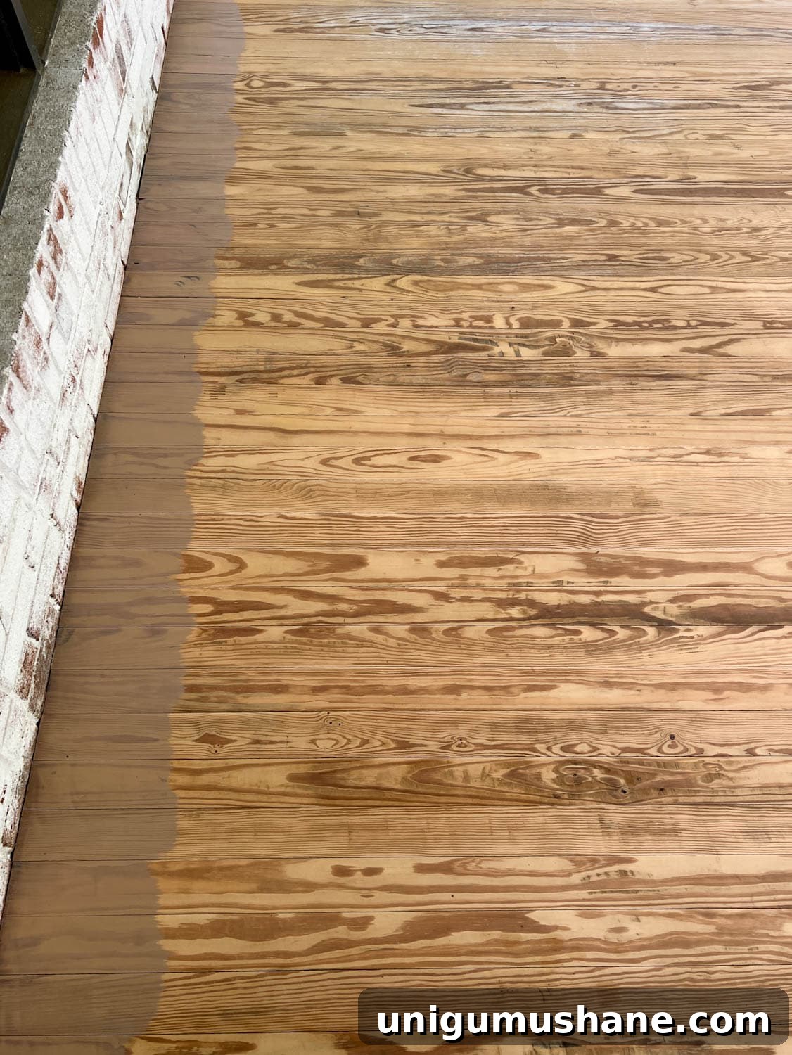 How to Get a Neutral Driftwood Look with Deck Stain 9 brushing behr stain color taupe on old deck wood