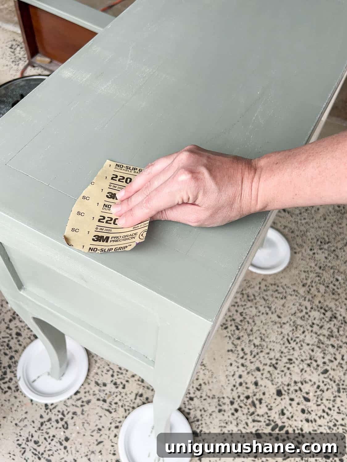 DIY Painted Nightstands: Pro Tip for Using Gloss Paint 11 sanding a nightstand for a smooth painted finish