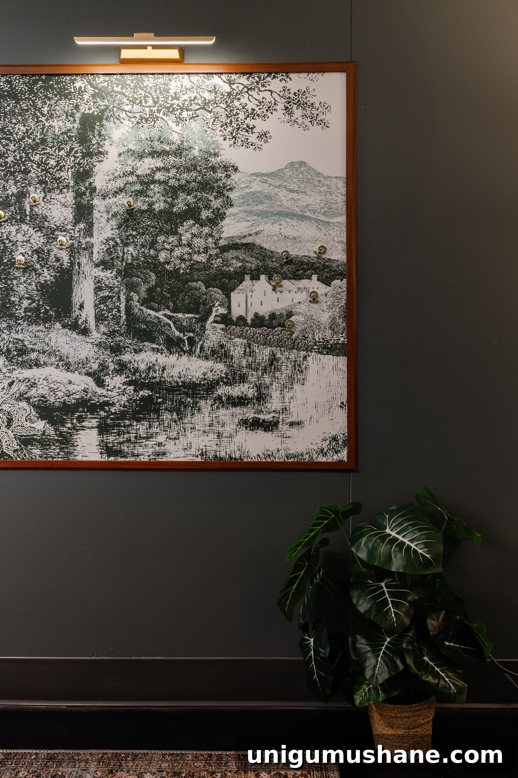 scenic art in a picture frame with a picture light with magnets used as a hidden memo board