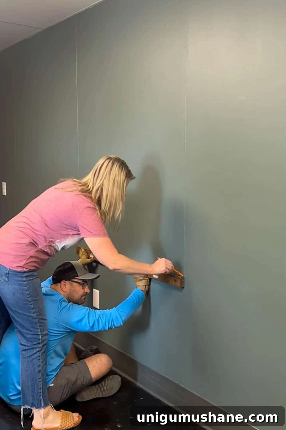 marking the wall with a level and pencil