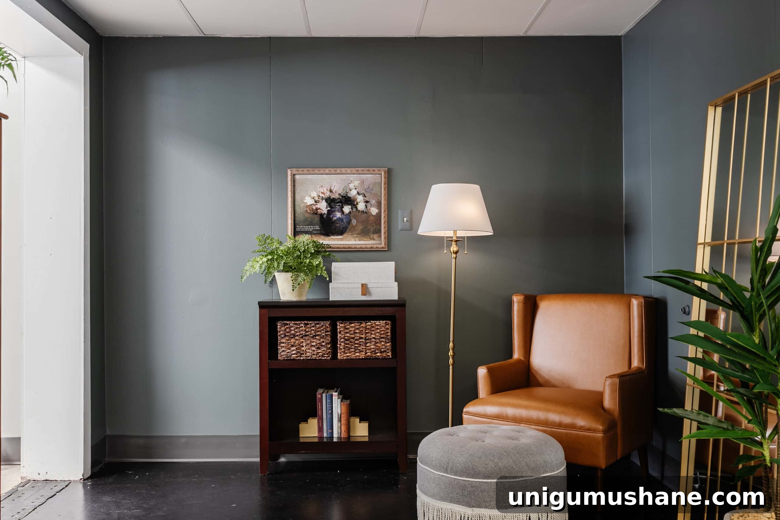 leather armchair with fringe ottoman footstool as a reading corner in an office