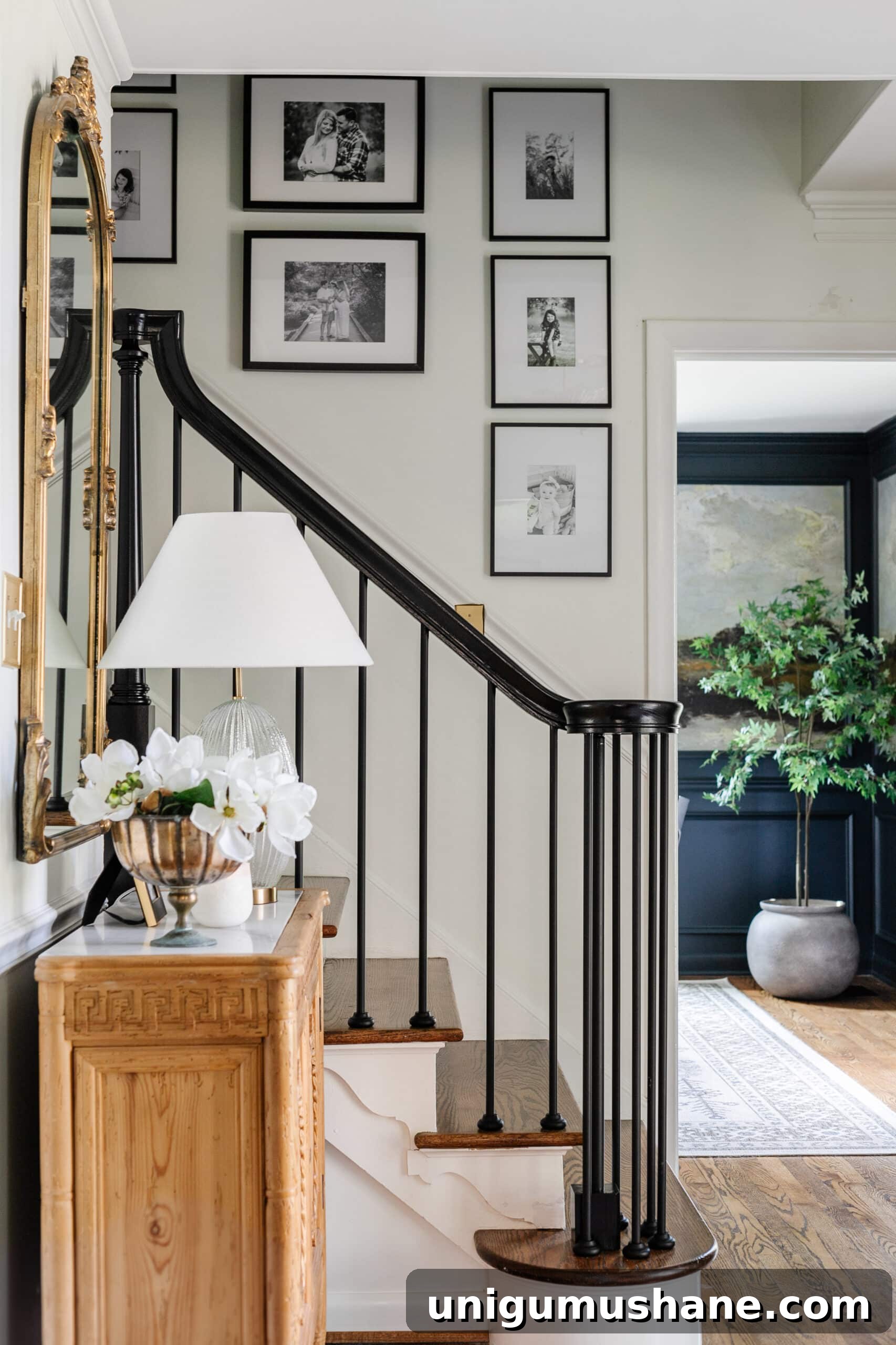 Avoid These Picture Frame Hanging Mistakes 3 black and white gallery wall going up stairs