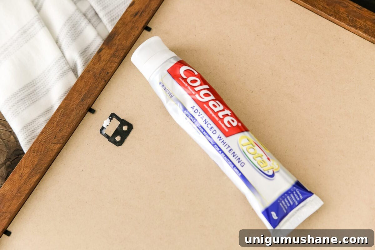 Avoid These Picture Frame Hanging Mistakes 6 toothpaste trick to hang pictures