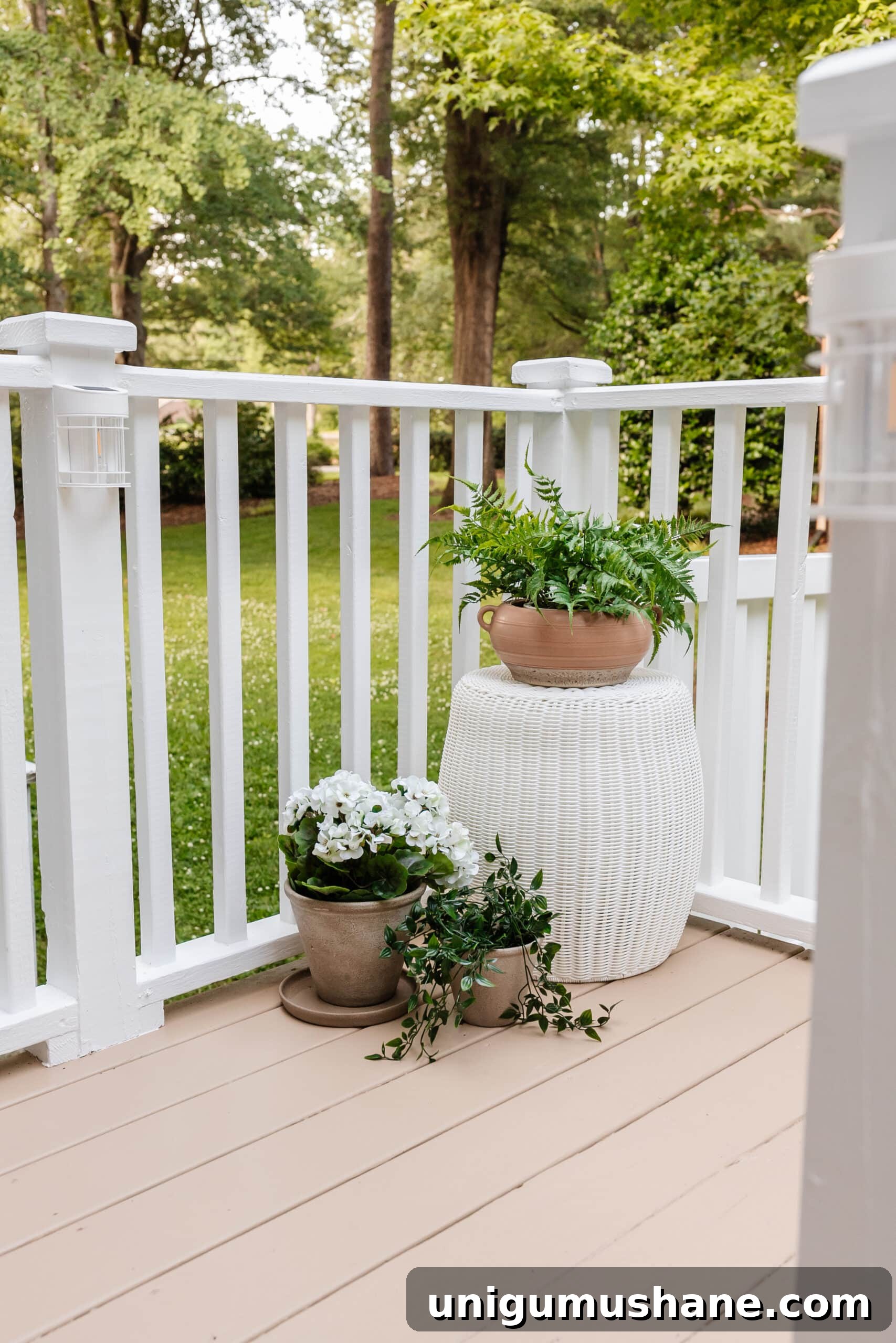 6 Small Side Porch Makeovers with Before and After Photos 11 woven outdoor end table with planters on a deck