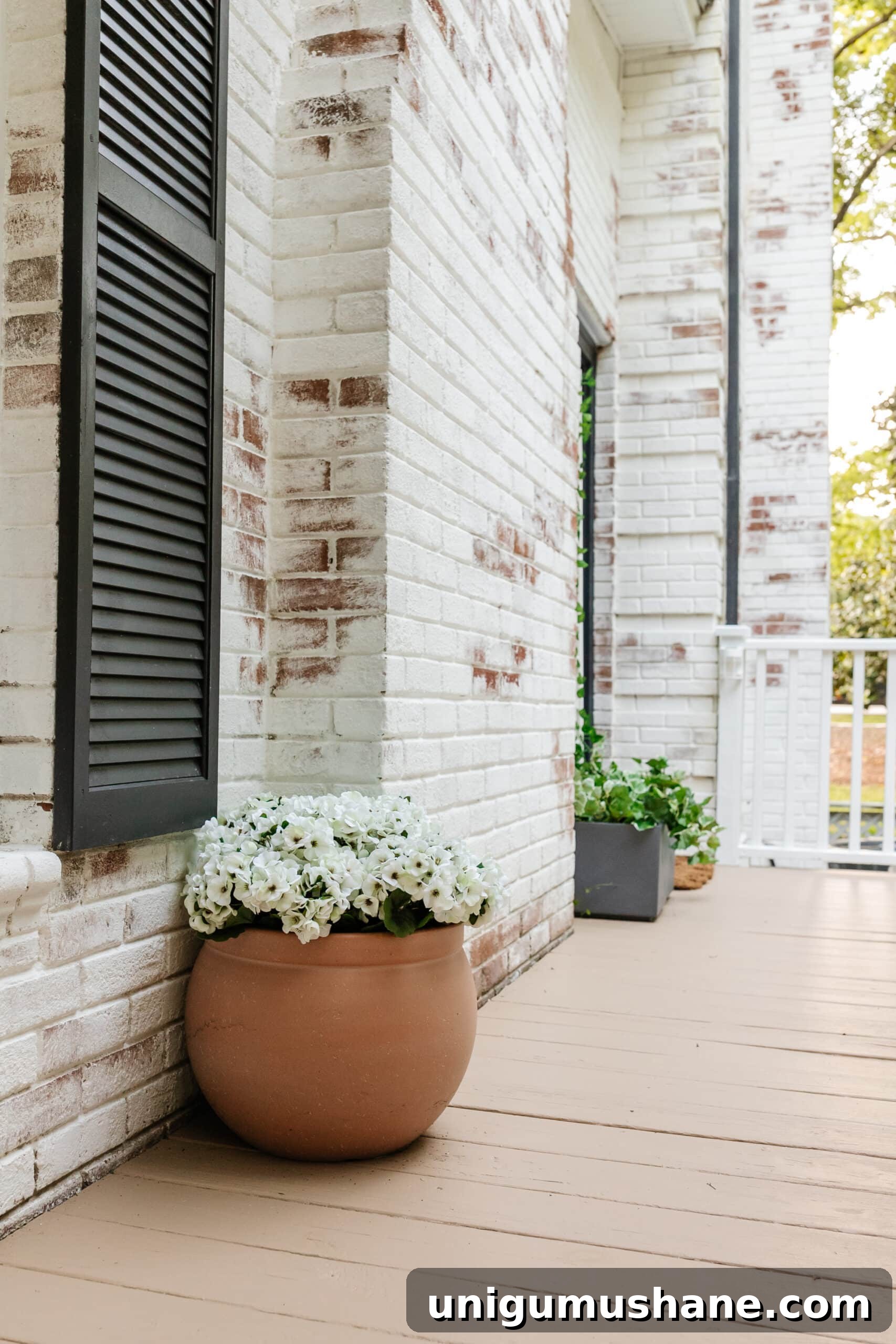 6 Small Side Porch Makeovers with Before and After Photos 16 side porch makeover with terracotta planter of faux flowers