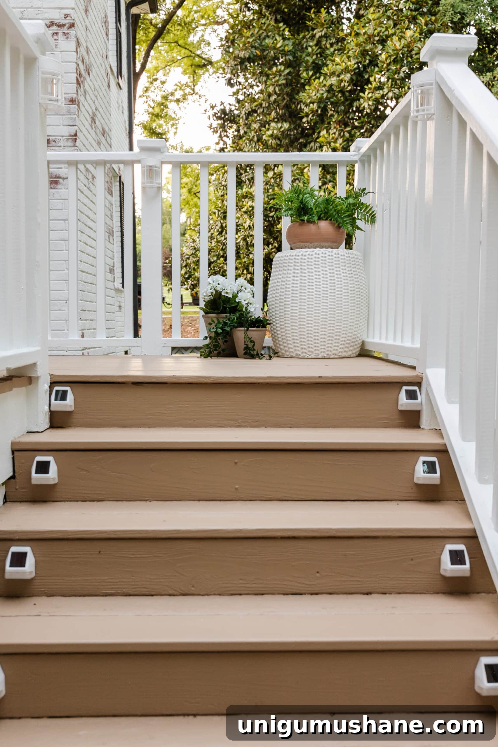6 Small Side Porch Makeovers with Before and After Photos 9 deck step solar lights on a deck with planters