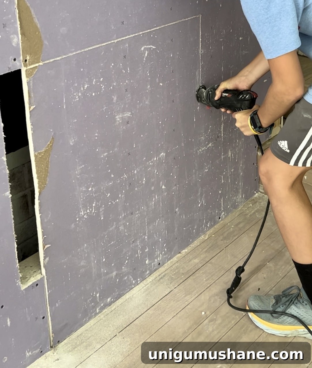 DIY Plaster Fireplace with Electric Insert Guide 13 cutting out a fireplace insert using a rotary saw