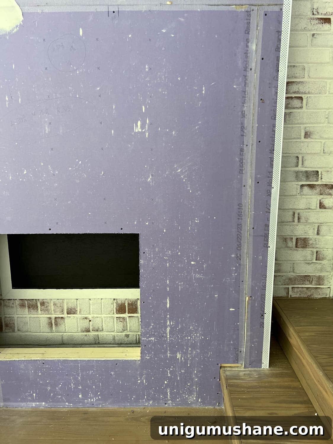 DIY Plaster Fireplace with Electric Insert Guide 15 taped drywall on a fireplace