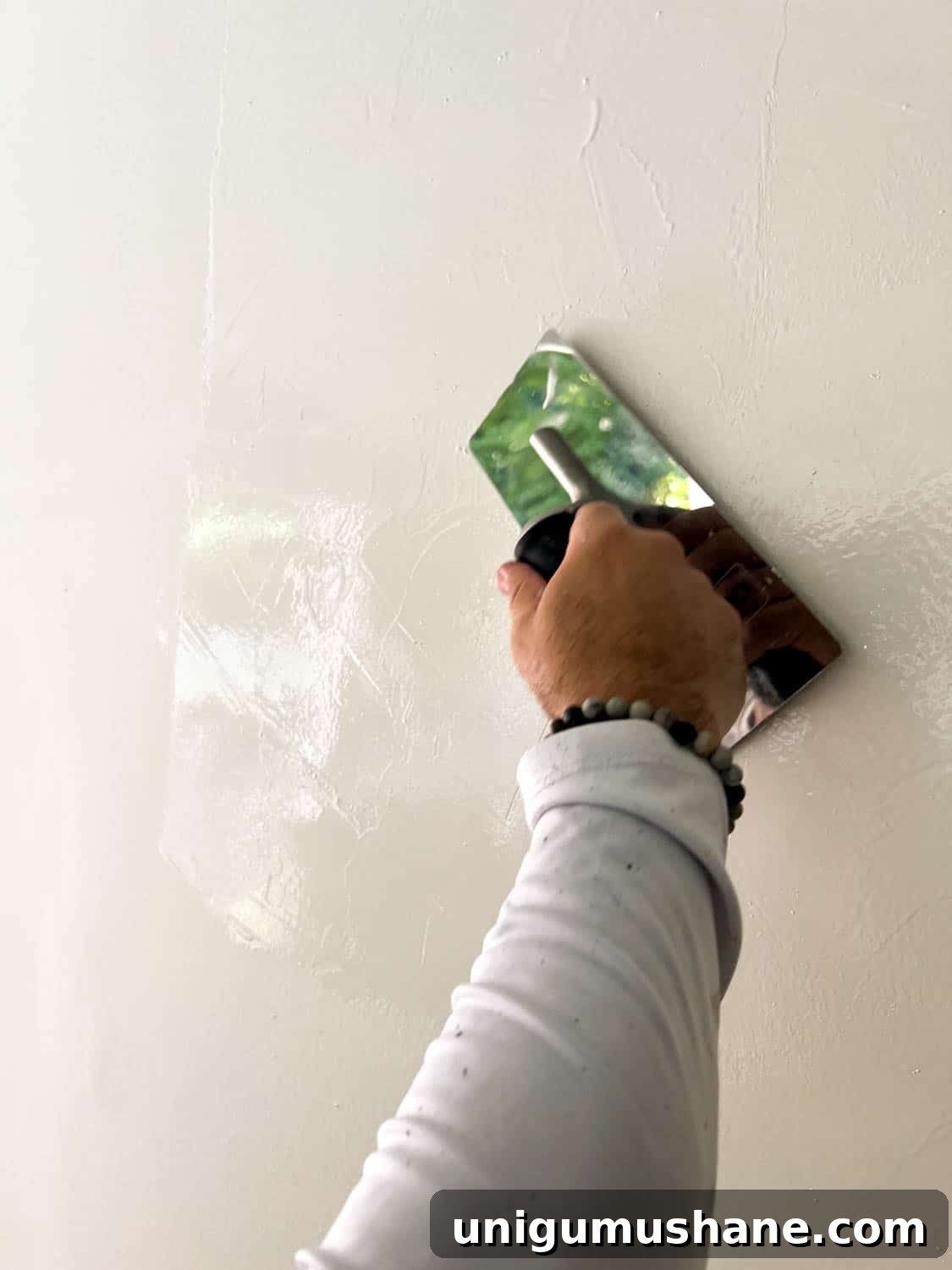 DIY Plaster Fireplace with Electric Insert Guide 22 applying Romabio Venetian Glaze plaster paint with a trowel