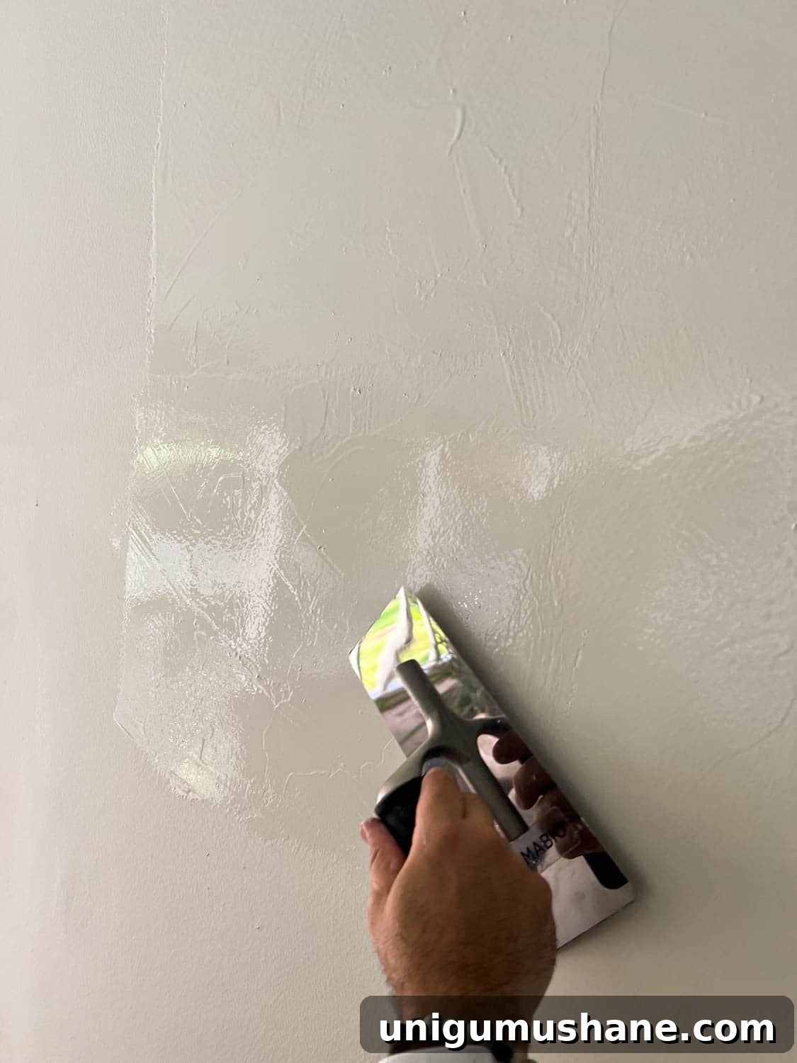 DIY Plaster Fireplace with Electric Insert Guide 23 applying Romabio Venetian Glaze plaster paint with a trowel