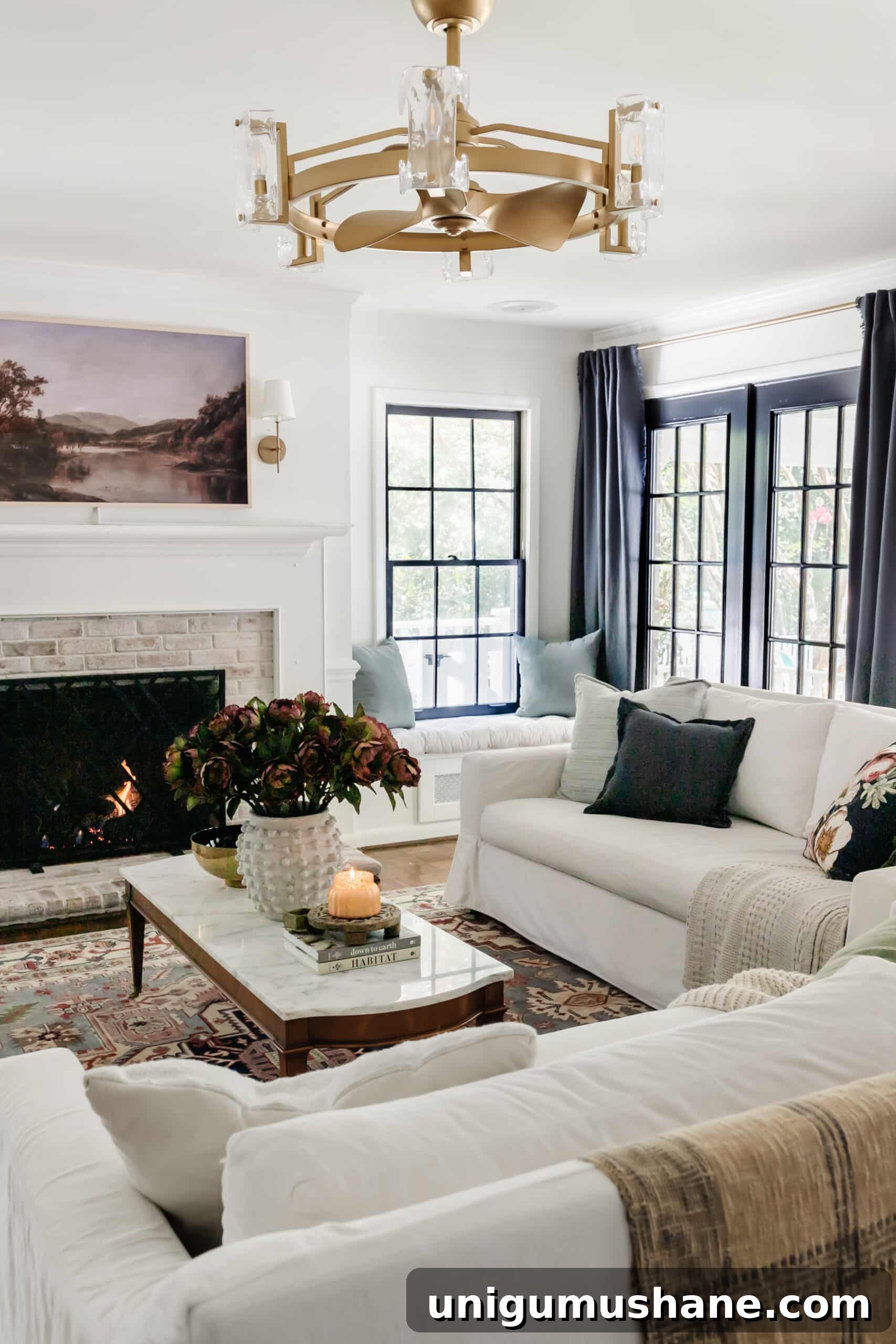 Start Decorating Your Living Room: A Step-by-Step Guide 2 fall living room with blue curtains, vintage rug, and fall art on tv above fireplace