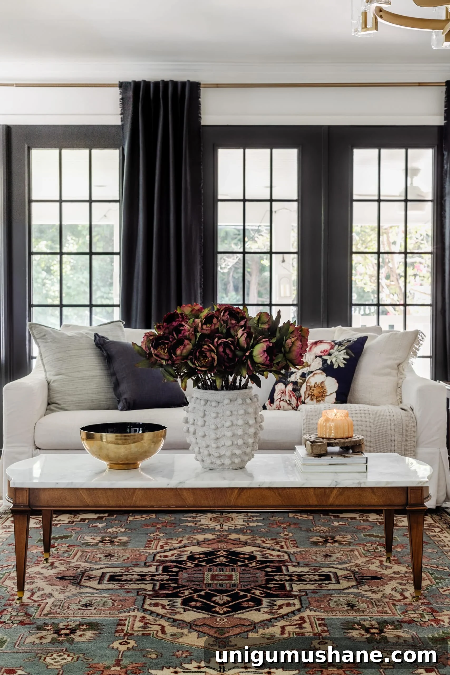 Start Decorating Your Living Room: A Step-by-Step Guide 5 white living room sofa with marble coffee table decorated for fall with burgundy flowers