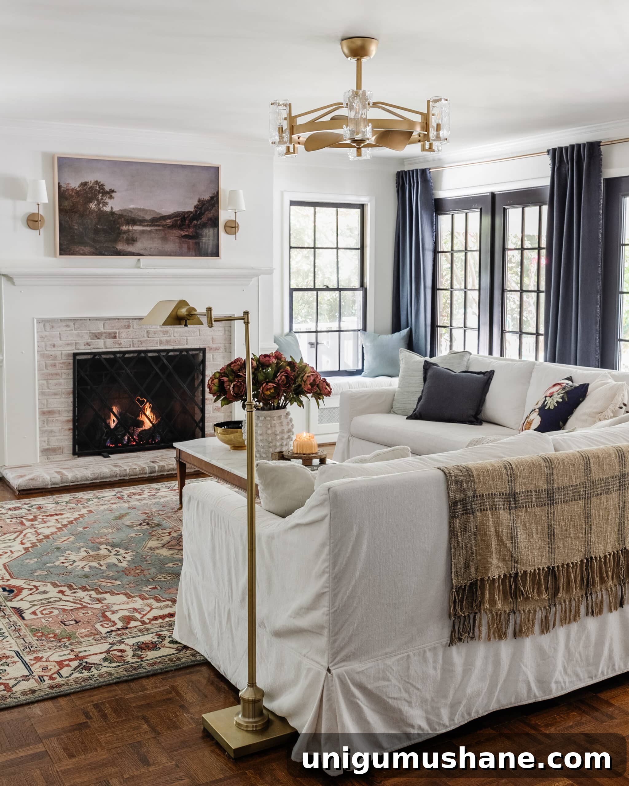 Start Decorating Your Living Room: A Step-by-Step Guide 7 modern traditional living room with brass floor lamp and plaid blanket on back of couch