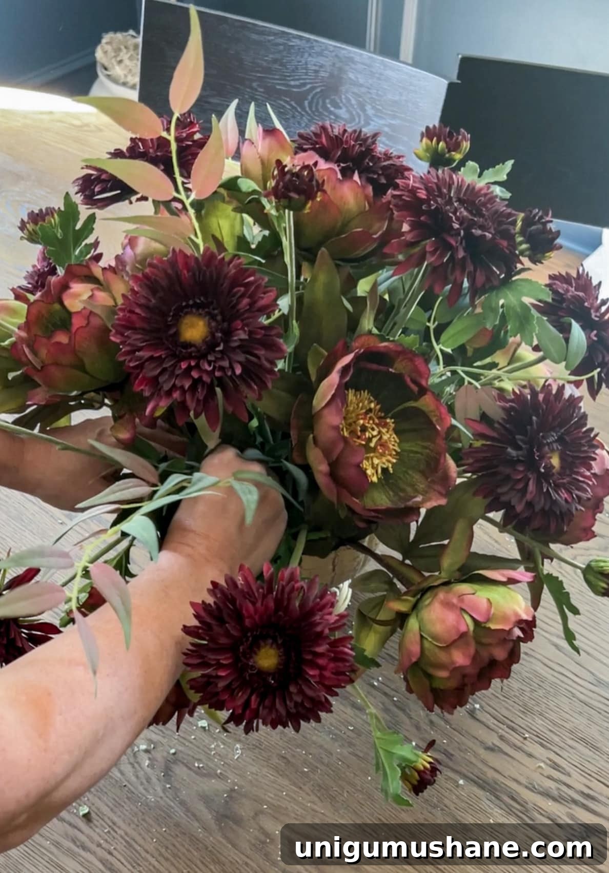 DIY Fall Floral Arrangement: Step-by-Step Guide 12 filling leaves into a fall centerpiece