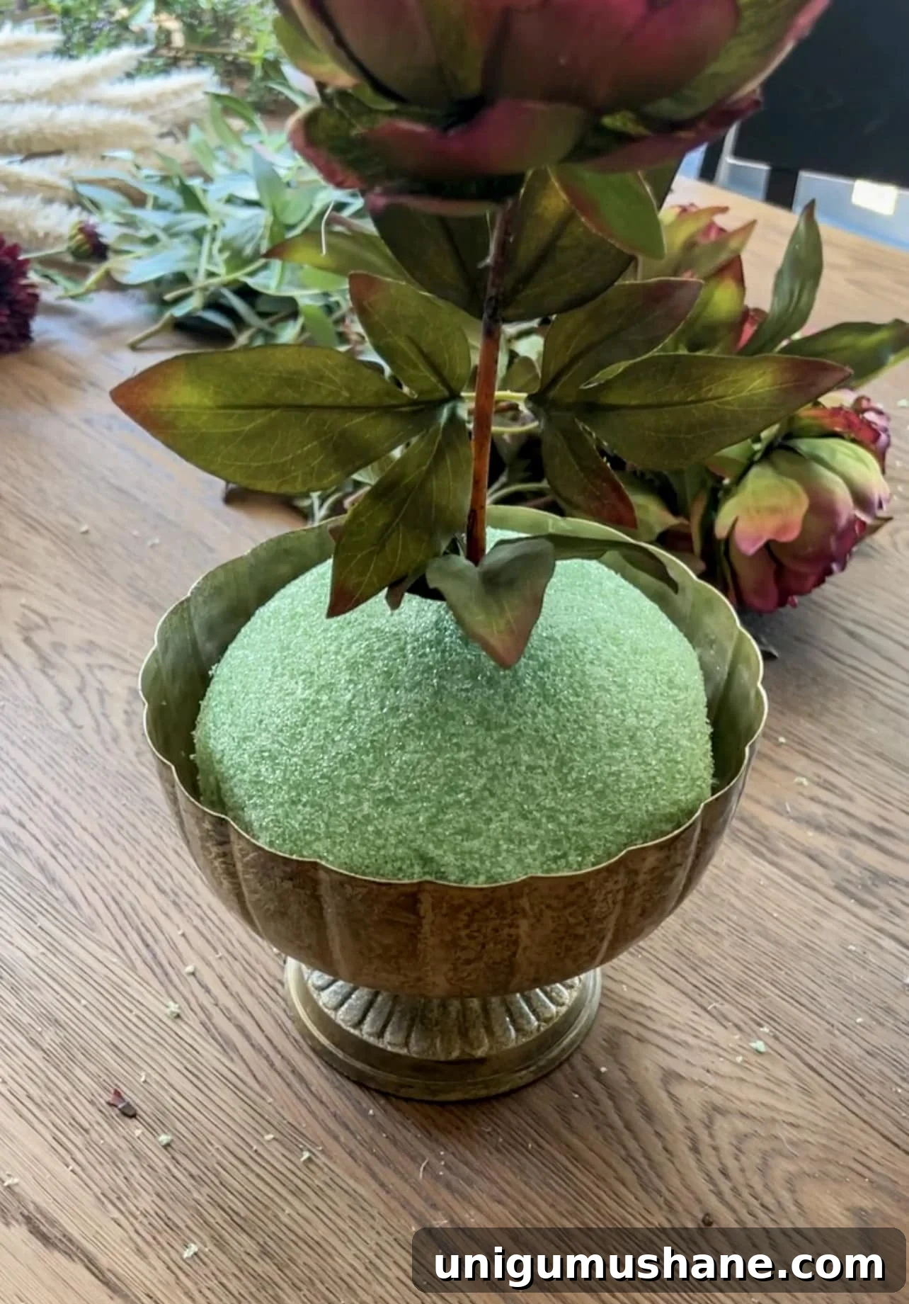 DIY Fall Floral Arrangement: Step-by-Step Guide 6 starting a floral arrangement with focal flower stem in top
