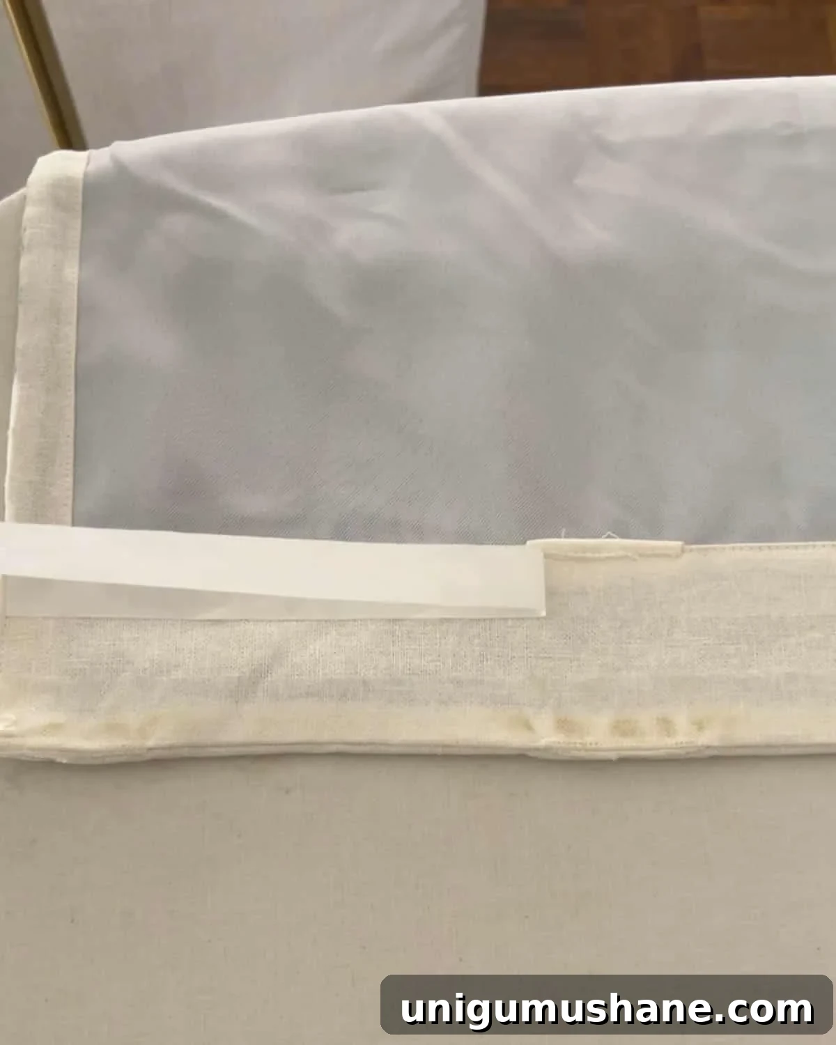 How to Make No-Sew Curtains with Trim 10 removing paper from hemming tape to iron