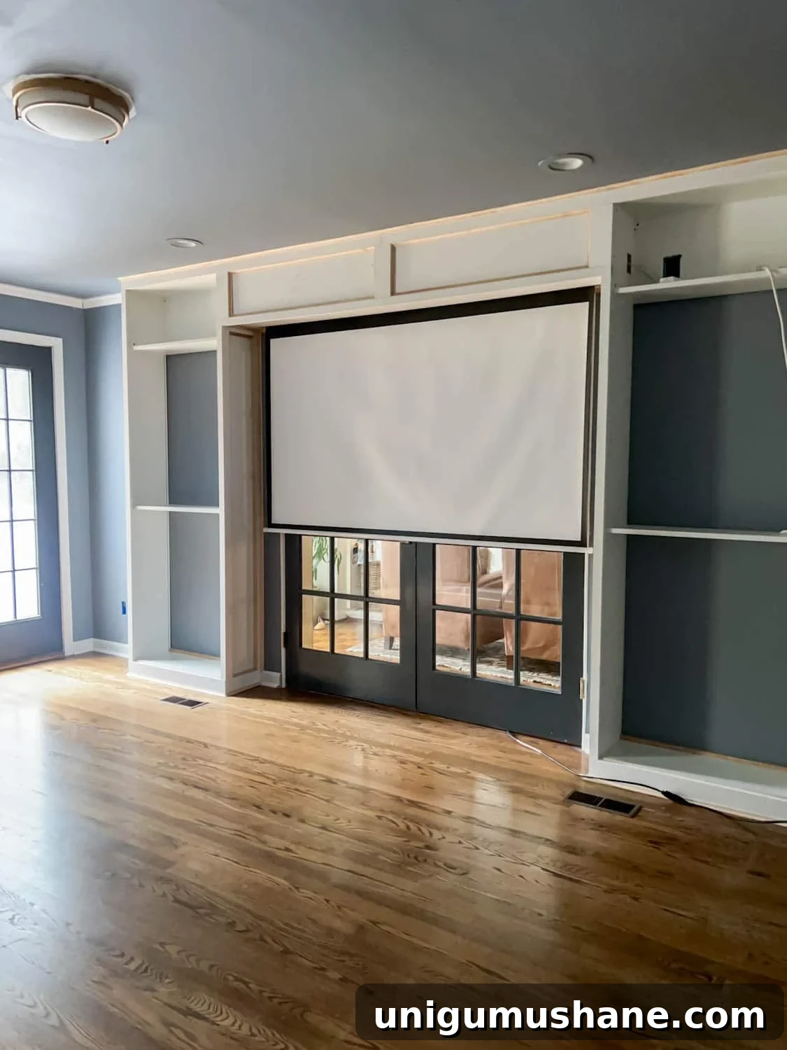 How to Build a Hidden Projector Screen with an IKEA Hack 2 hidden built in projector screen in media room