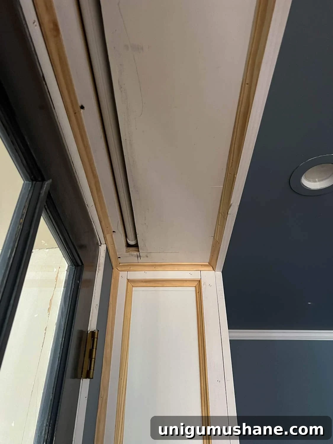How to Build a Hidden Projector Screen with an IKEA Hack 11 hidden projector screen box between bookcases above french doors